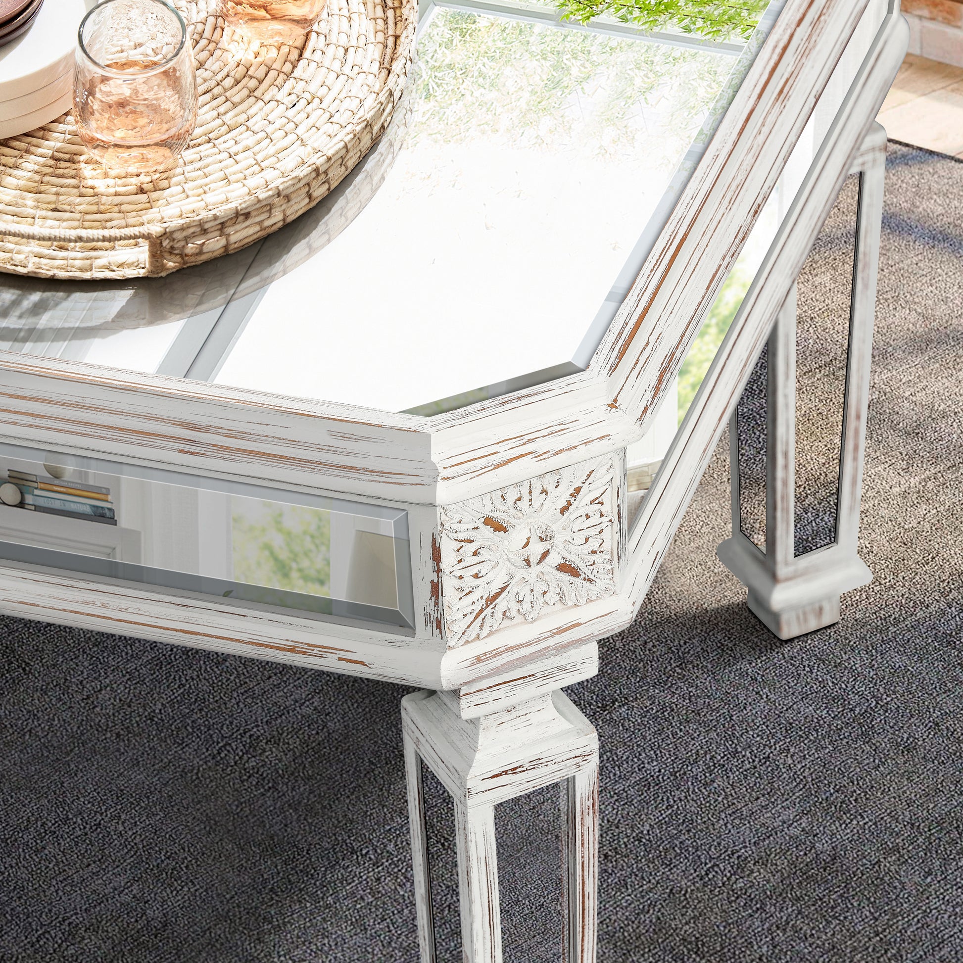Distressed white wood coffee table with mirrored panels and ornate carvings