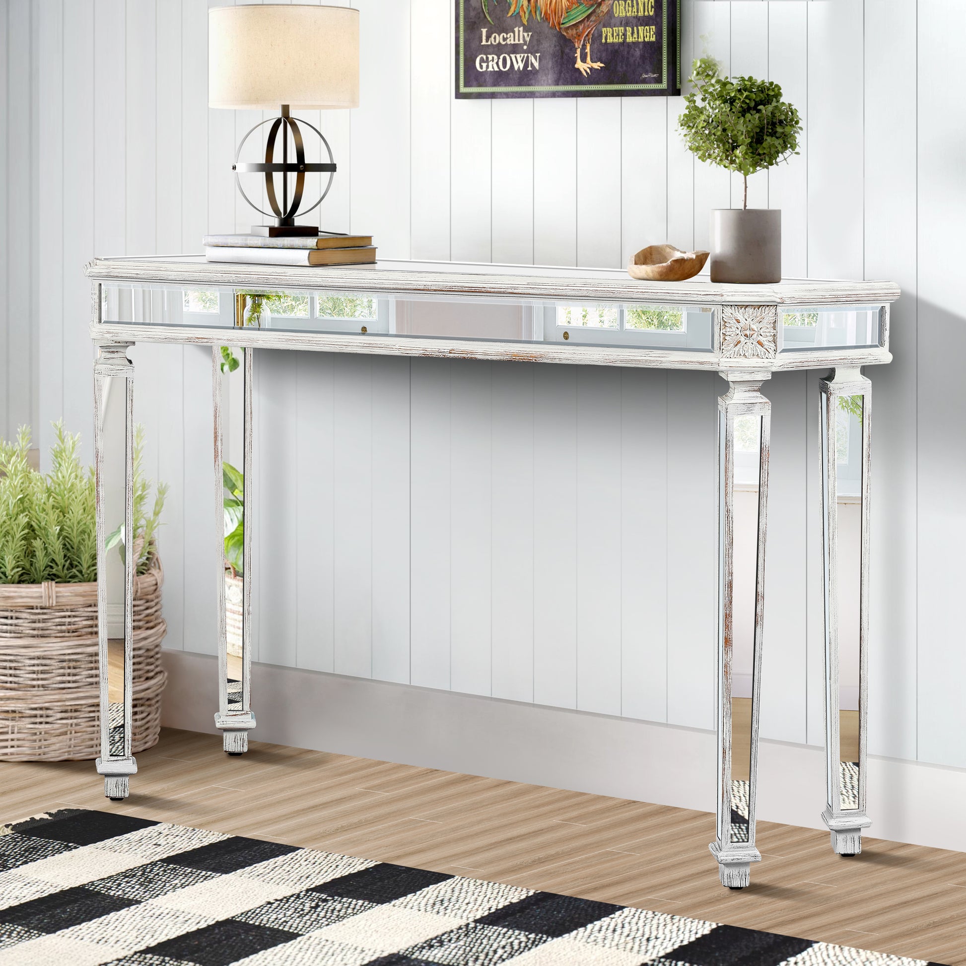 Antique white console table with mirrored accents and carved detailing