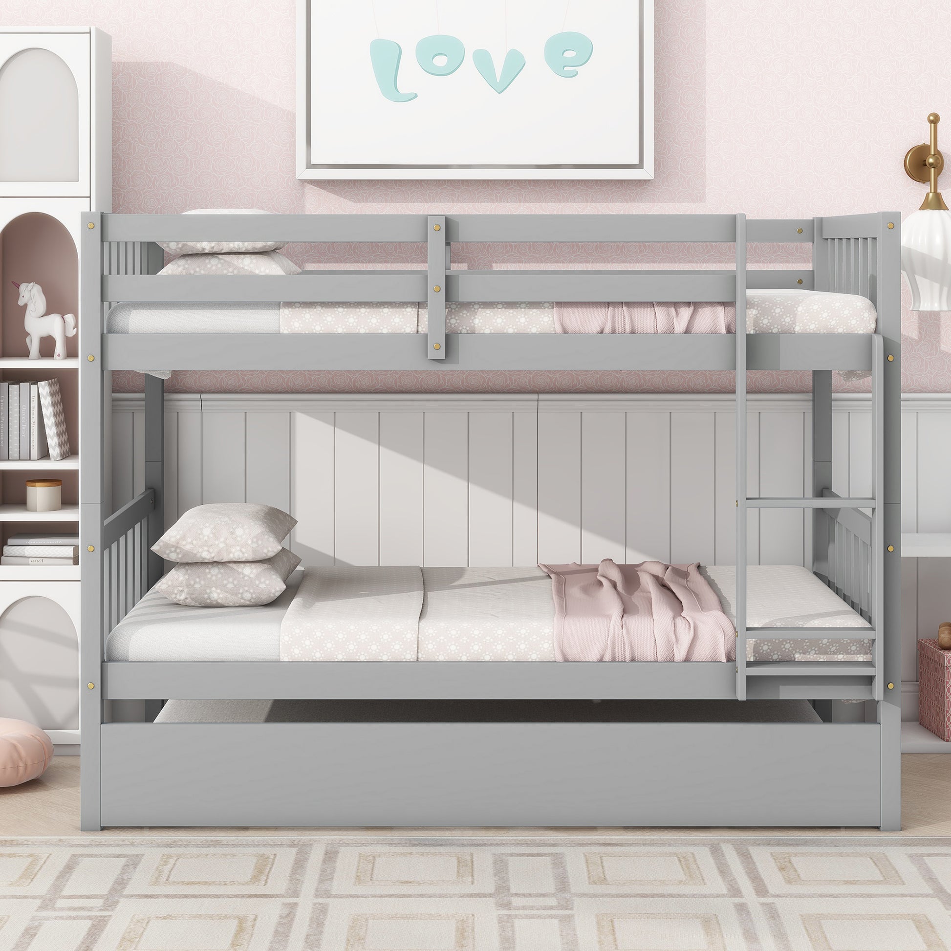 Gray wooden bunk bed with pink bedding and two mattresses