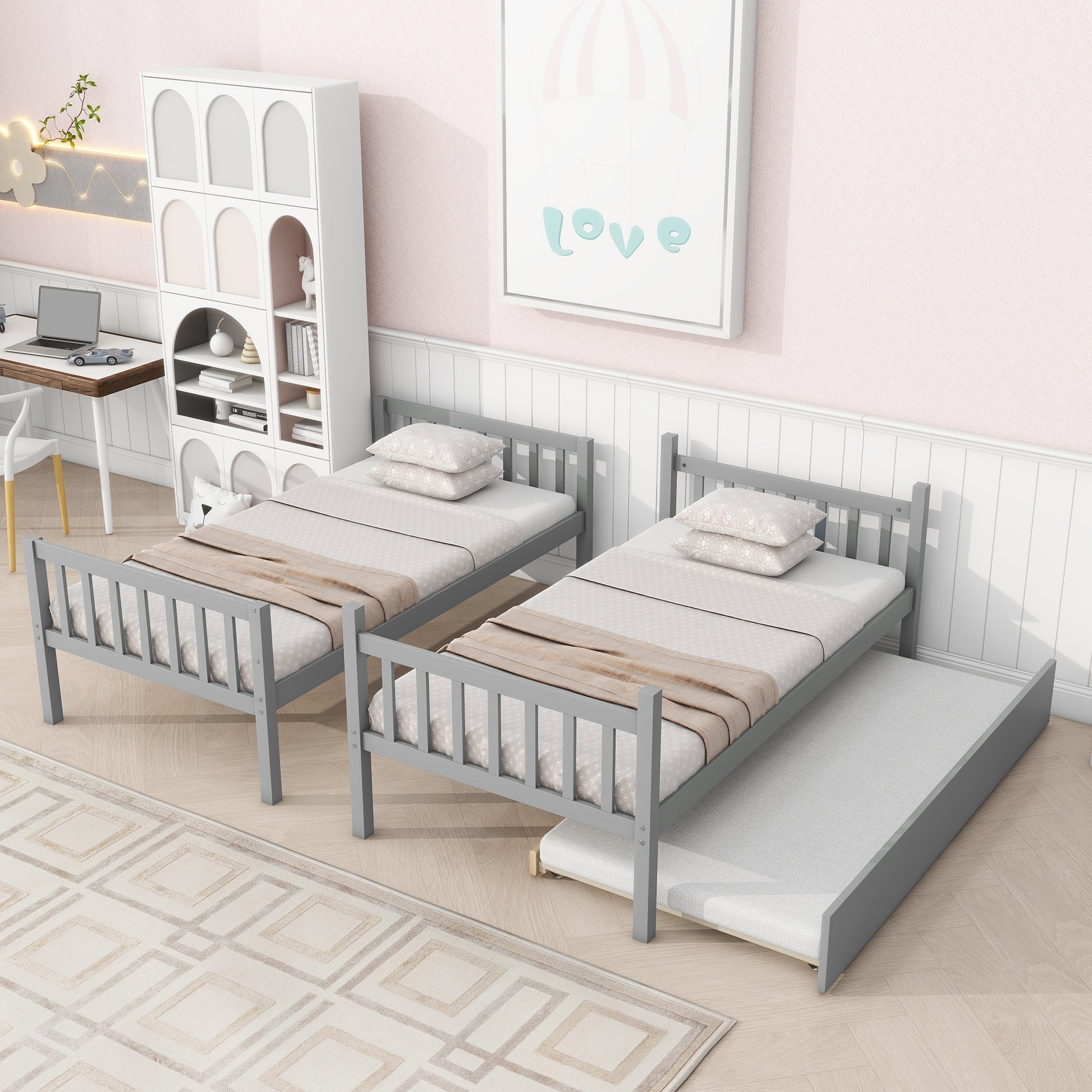 Gray wooden twin bed with pullout trundle and beige bedding perfect for kids