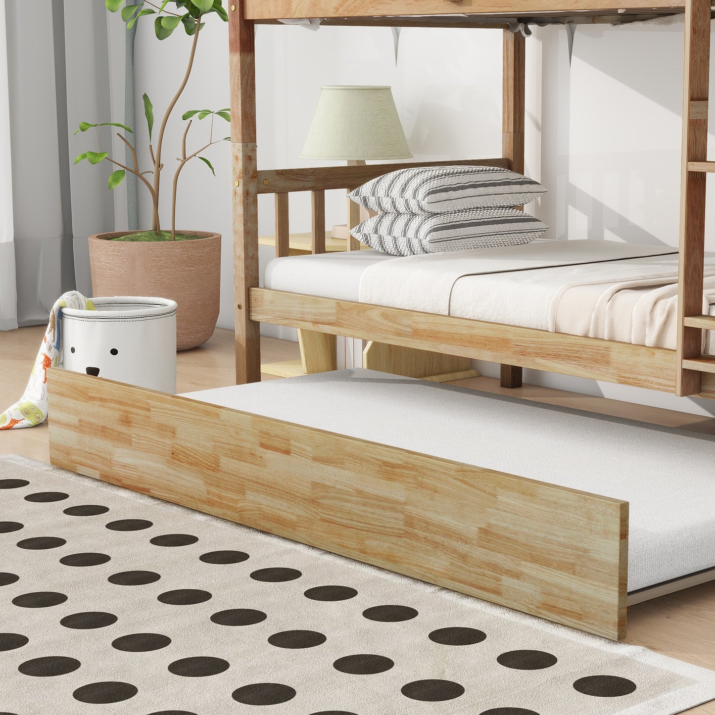 Natural wood twin over twin bunk bed with pullout trundle and white bedding