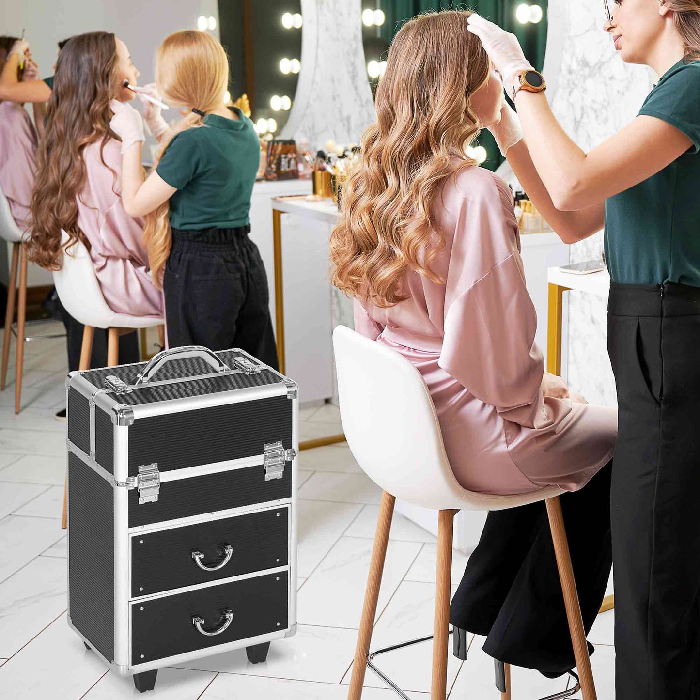 Black aluminum makeup train case with silver latches and three drawers