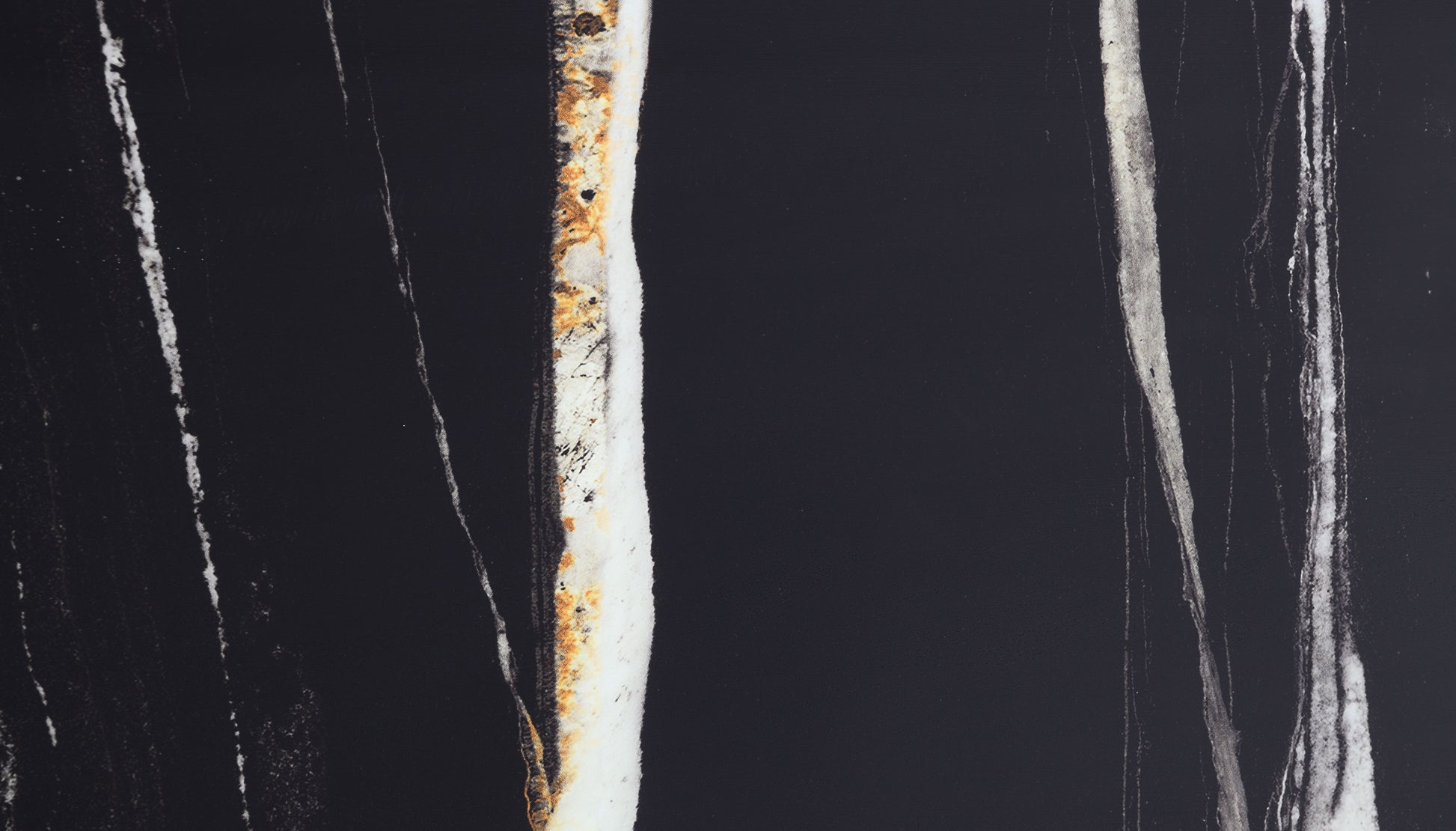 Black marble slab with abstract white and gold veining