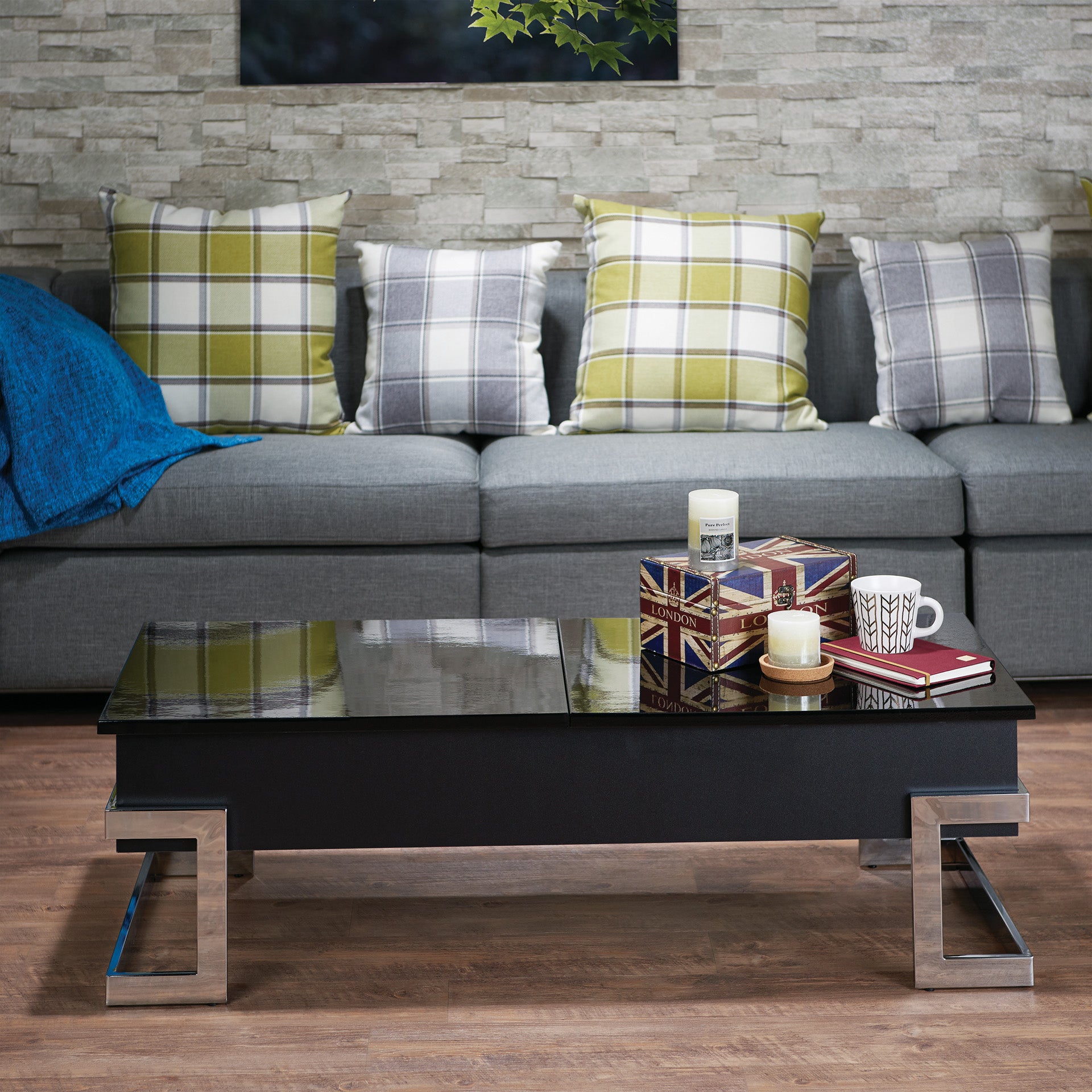 Sleek black coffee table with chrome legs and a glass top