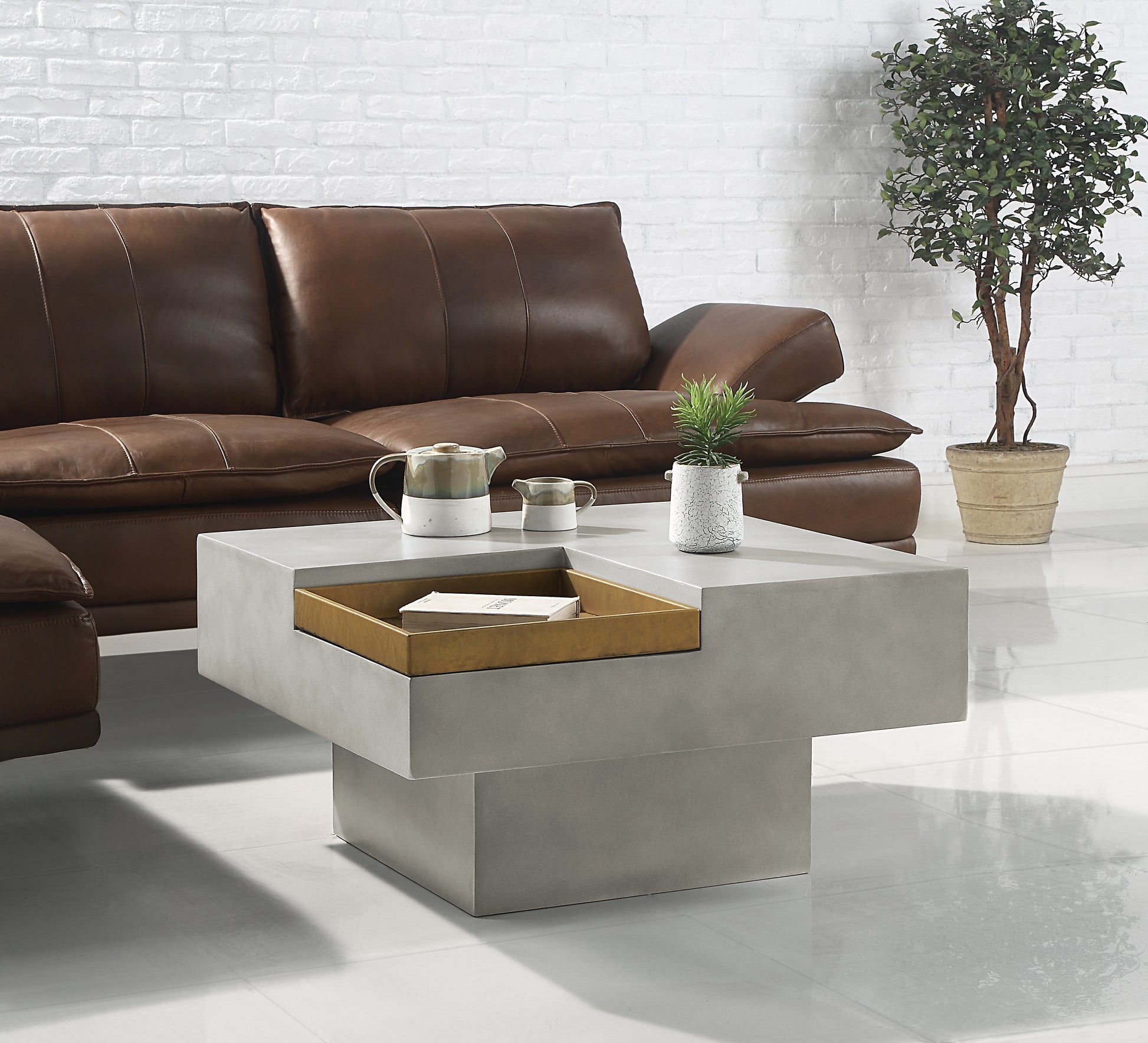 Modern concrete coffee table with gold tray detail