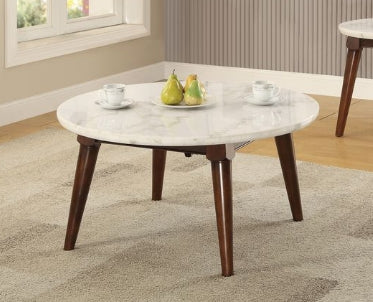 Round white marble top coffee table with dark wood tapered legs