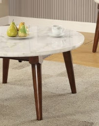 Round white marble top coffee table with dark wood tapered legs