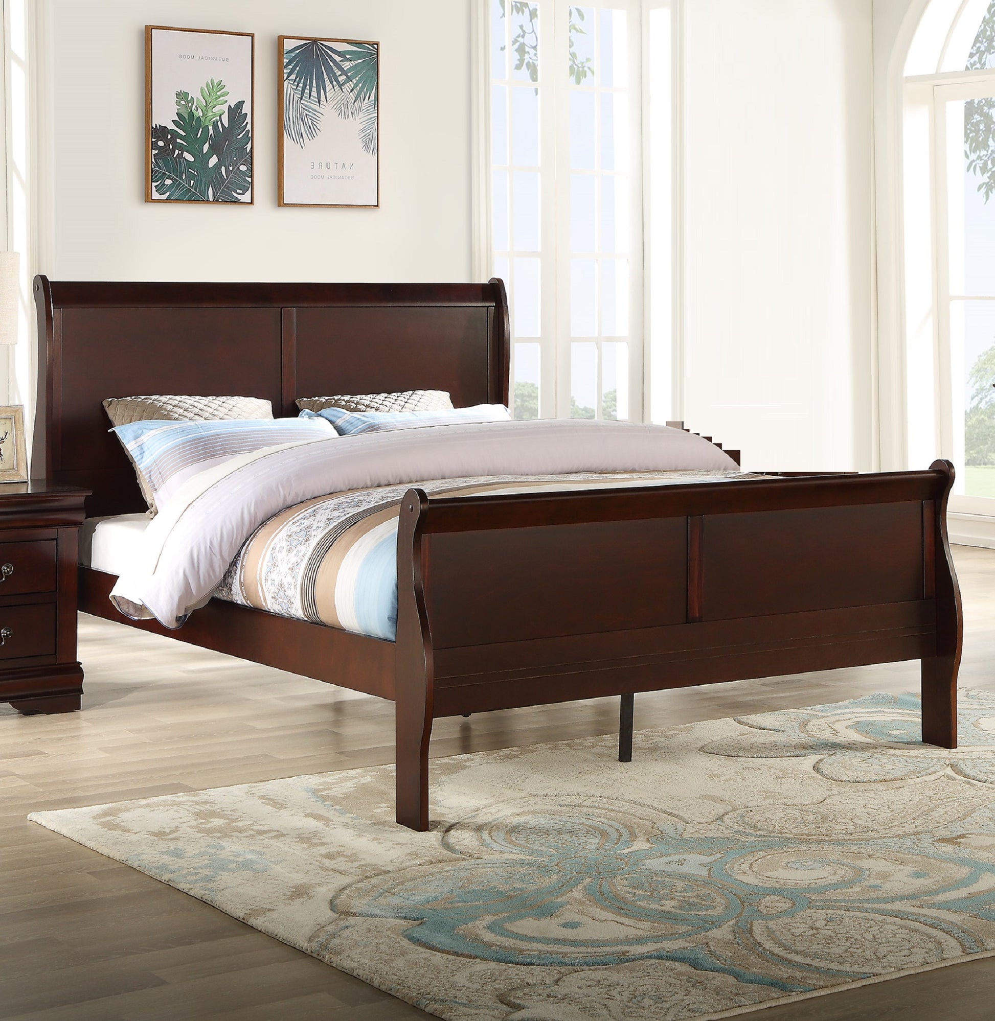Rich mahogany wood sleigh bed with upholstered headboard