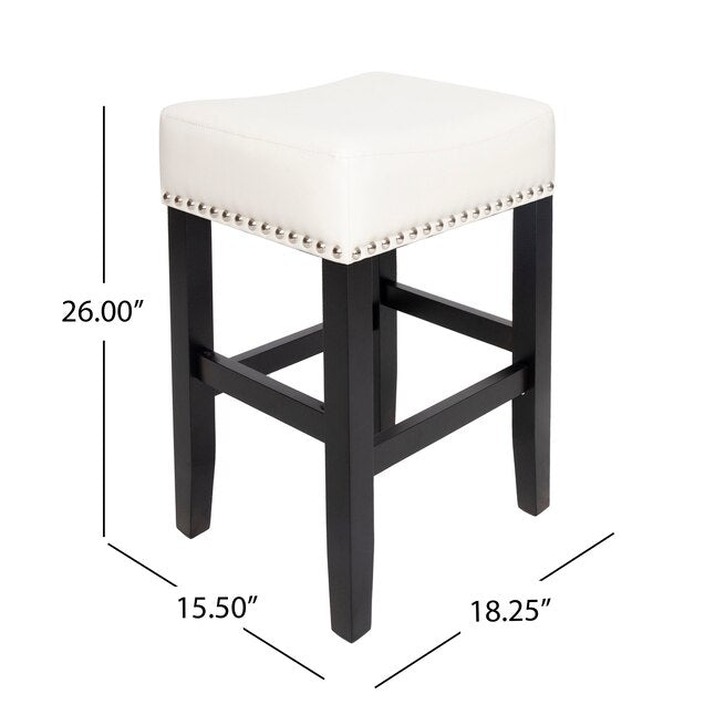 White upholstered saddle bar stool with silver nailhead trim and black wooden legs