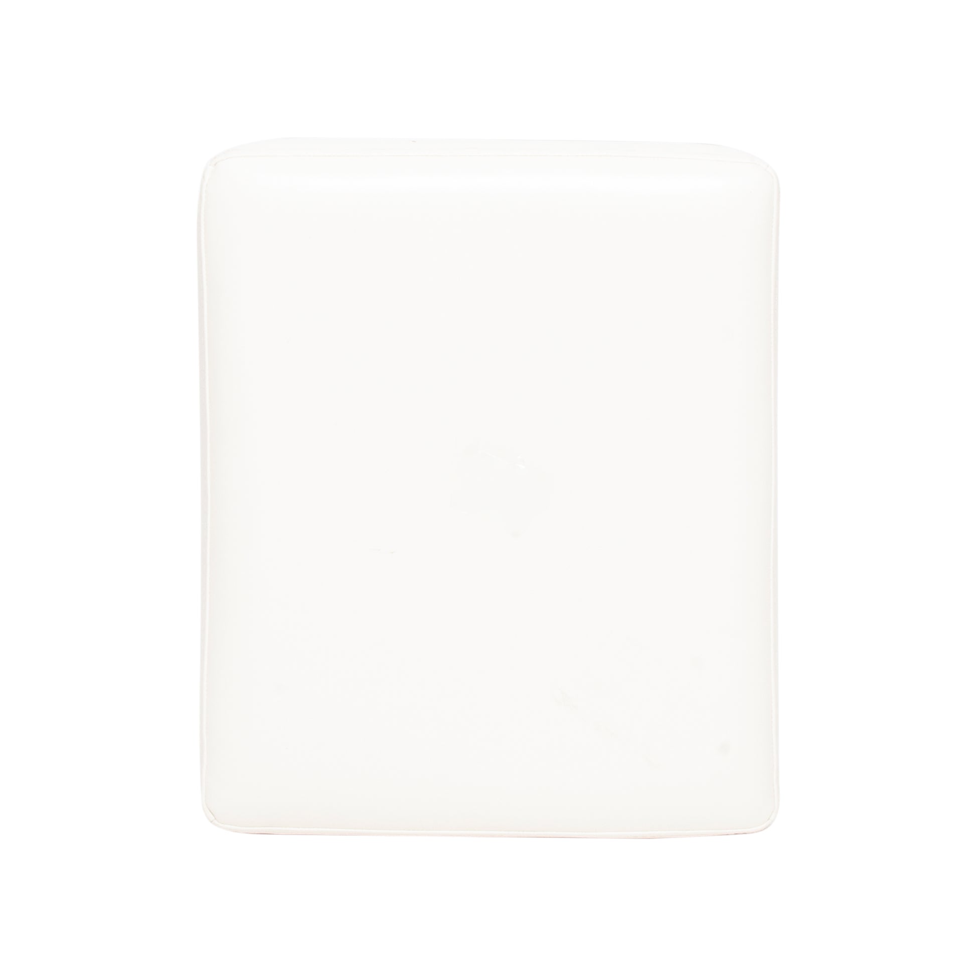 White cushioned ottoman with subtle piping