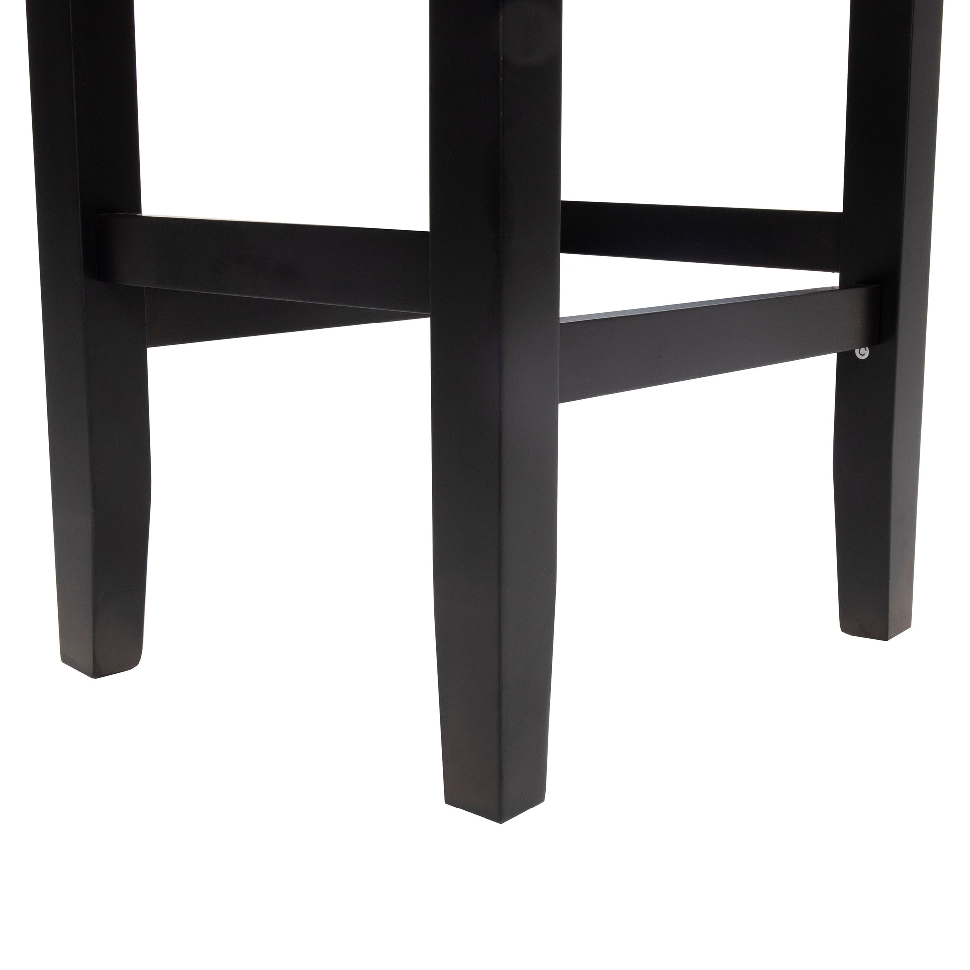 Closeup of black wooden bar stool legs showcasing sturdy construction and clean lines