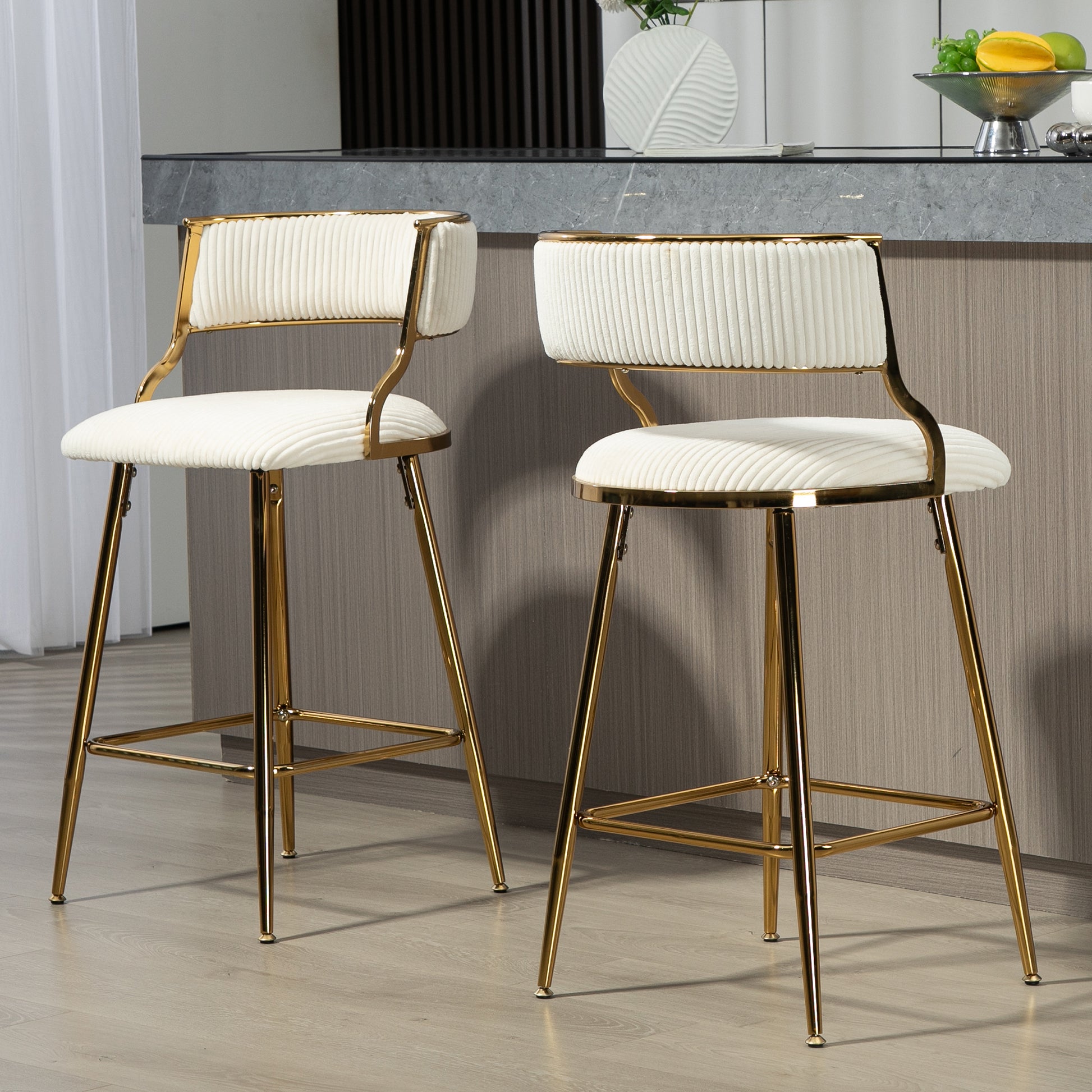 Cream upholstered bar stool with gold metal frame and ribbed detailing