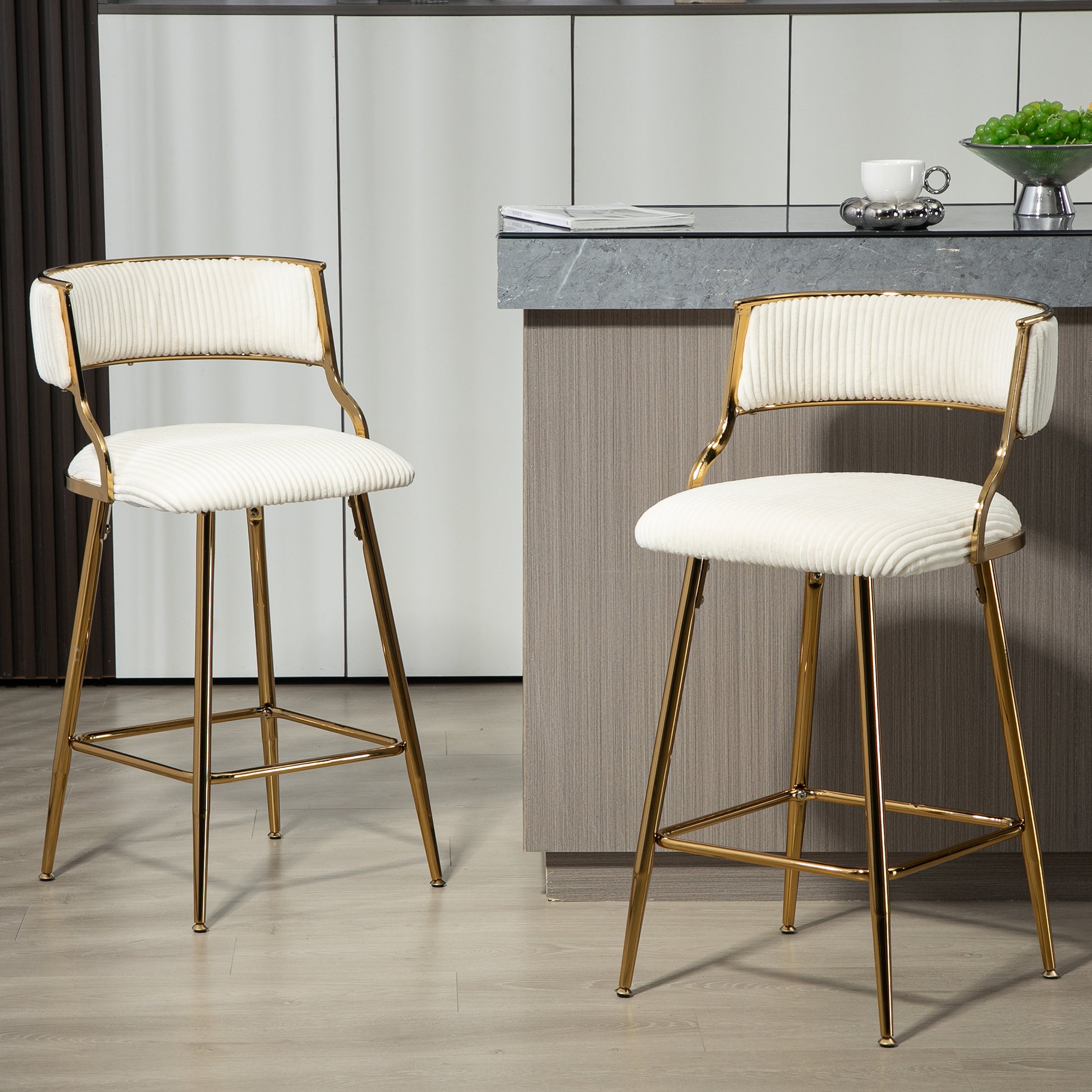 White velvet channeltufted bar stool with polished gold legs
