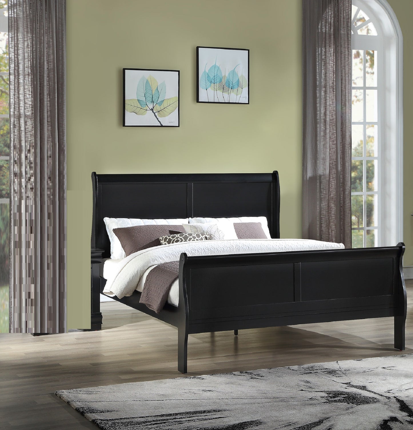 Black sleigh bed with plush bedding and decorative pillows