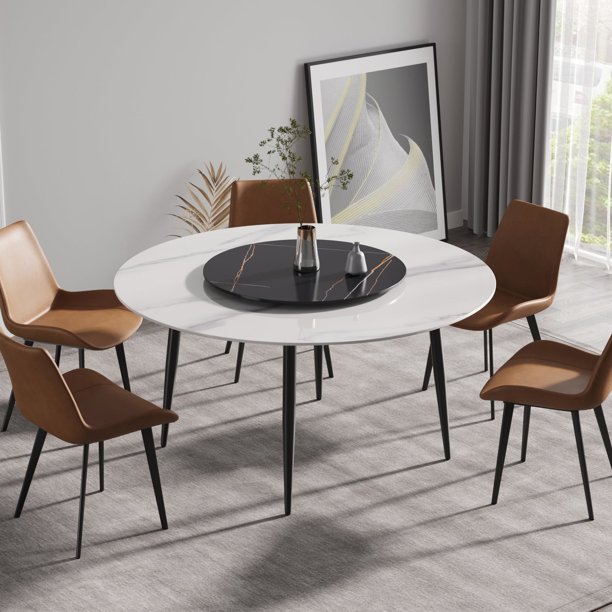 Round white marble dining table with rotating black centerpiece and four cognac leather chairs