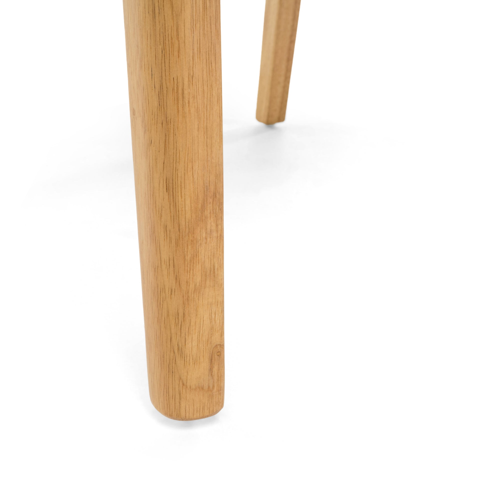Closeup of natural wood grain on rounded furniture leg