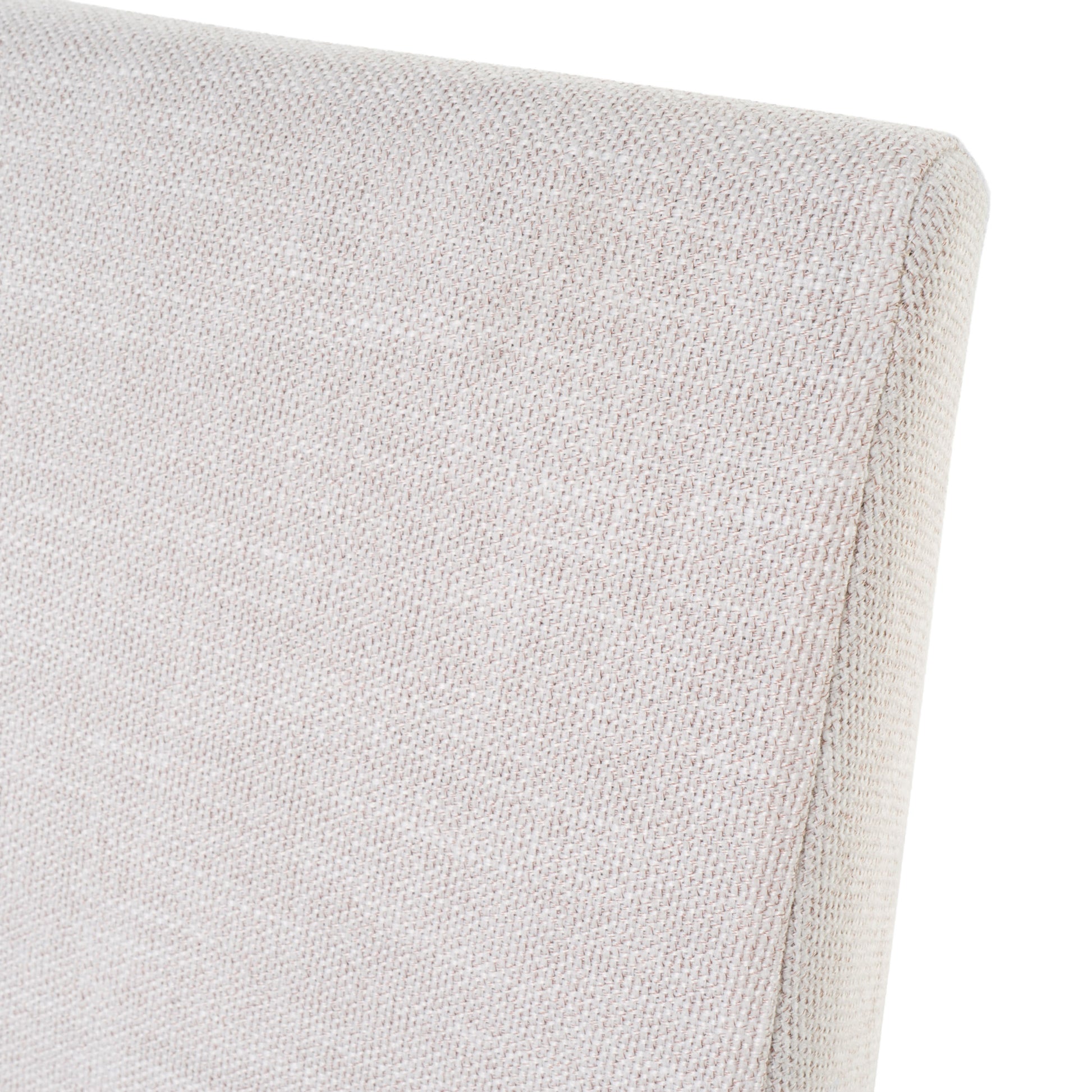 Close up of a textured beige fabric upholstery on a chair
