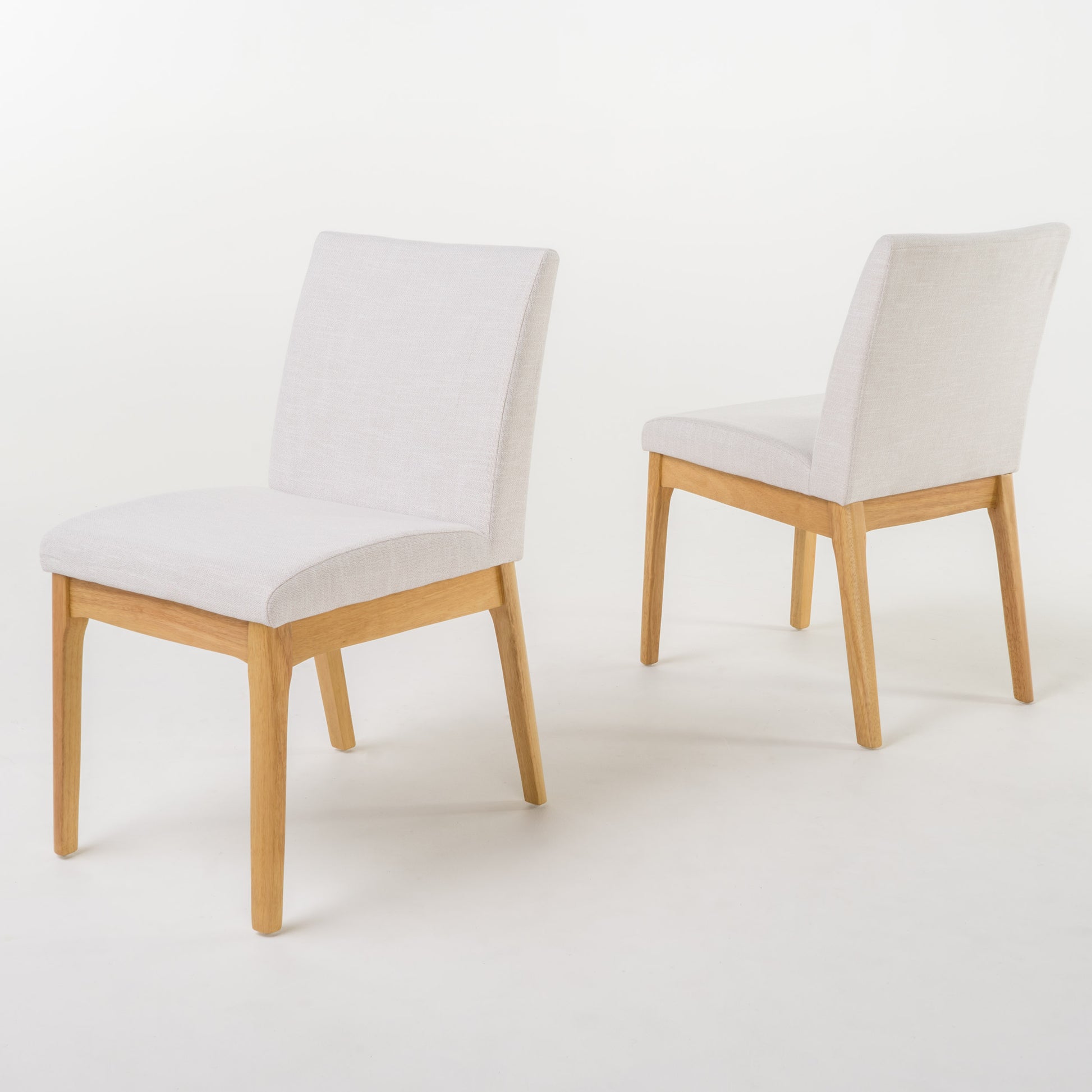 Light grey upholstered dining chair with natural wood legs