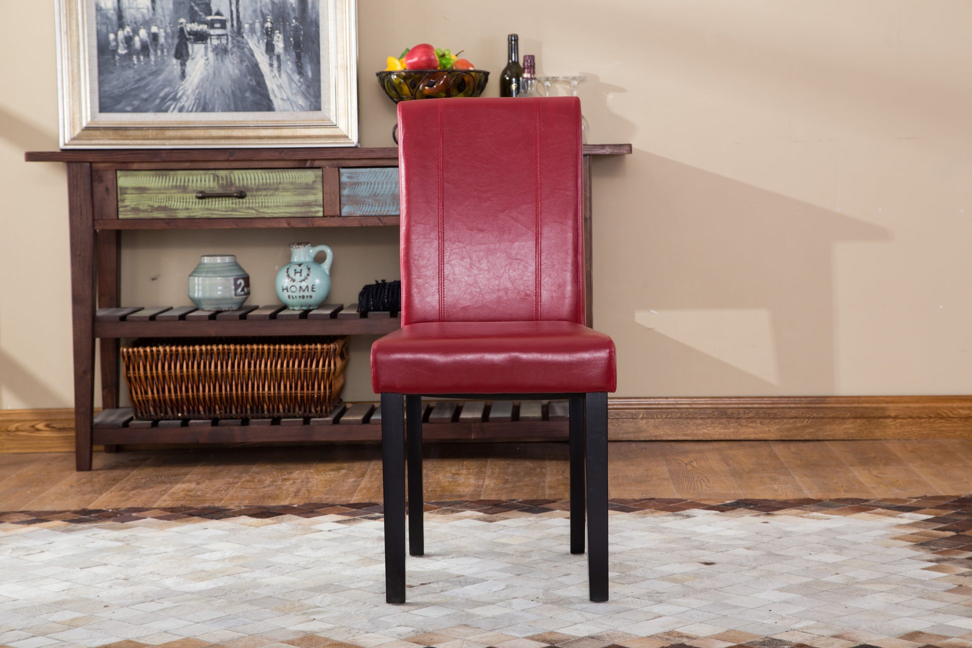 Red faux leather dining chair with stitched detailing and black wooden legs