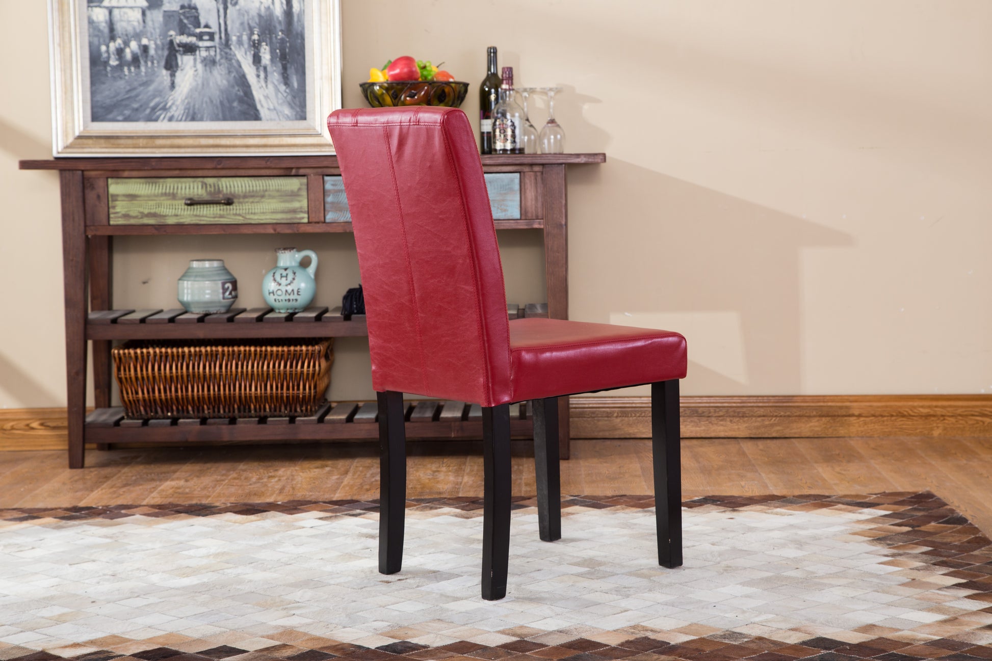 Red faux leather dining chair with stitched detailing and dark wooden legs