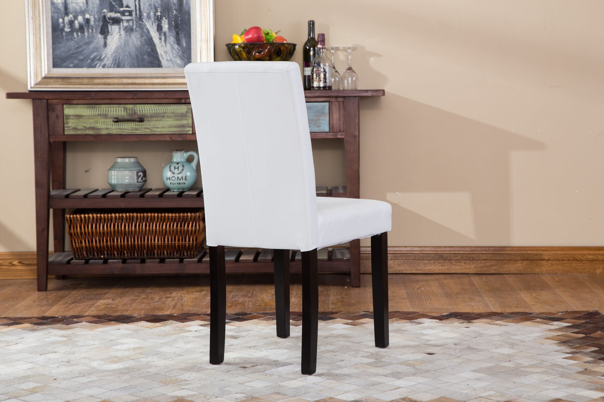 White faux leather dining chair with dark wood legs