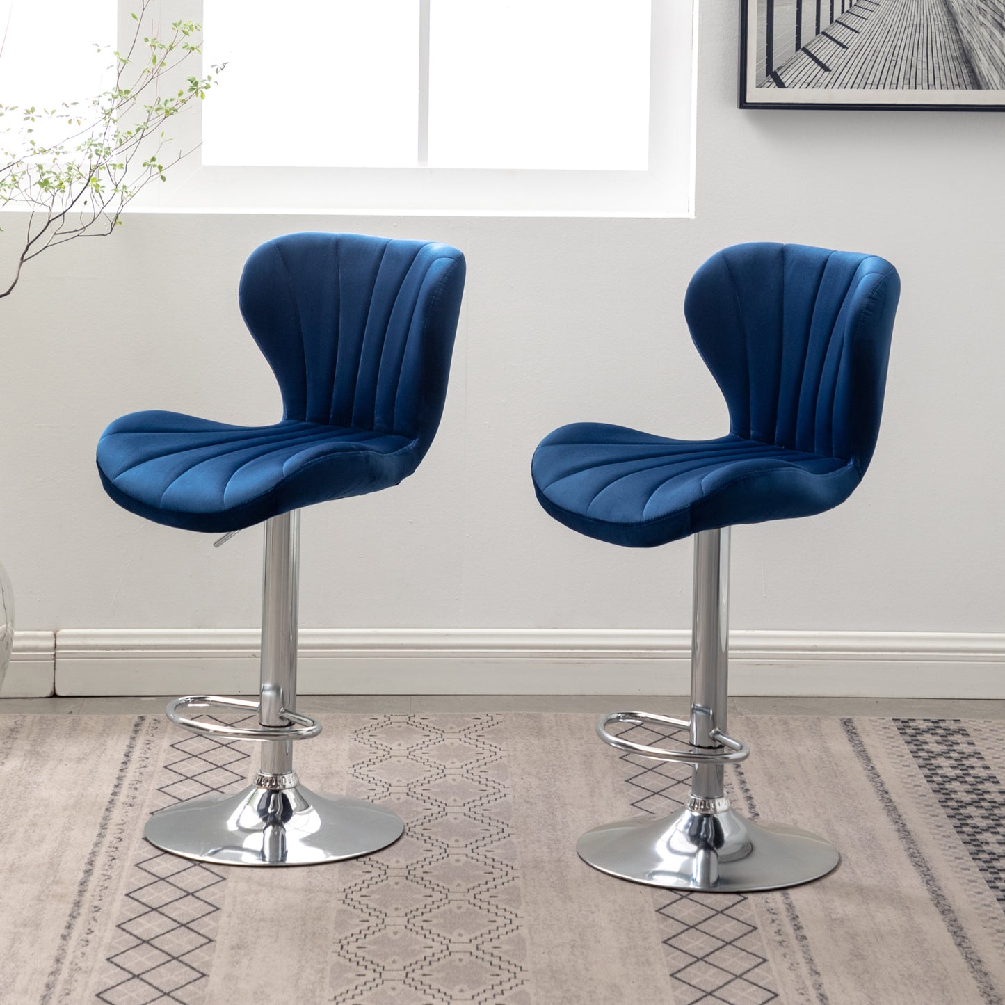 Plush navy velvet bar stool with chrome base and adjustable height