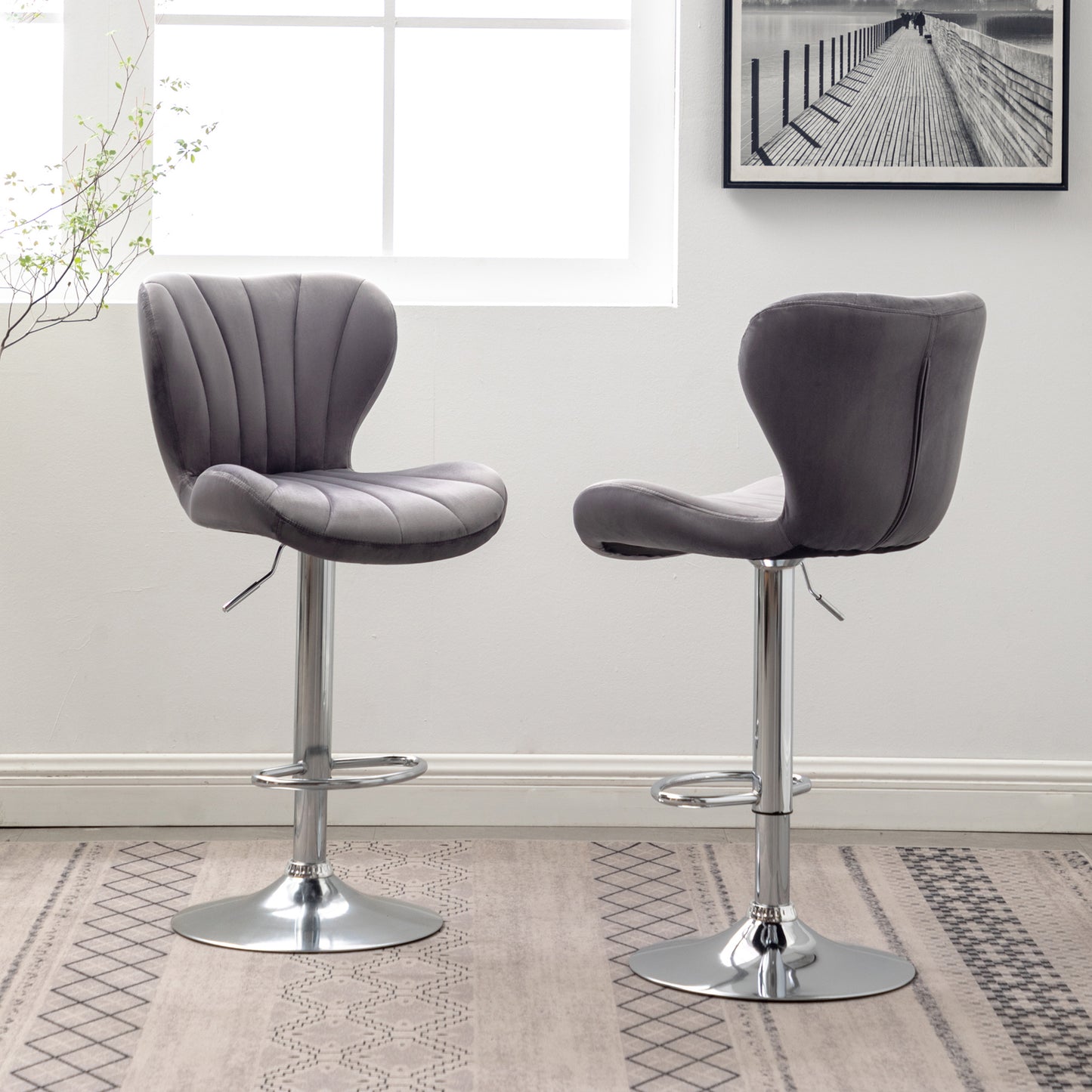 Grey velvet bar stool with tufted backrest and chrome base