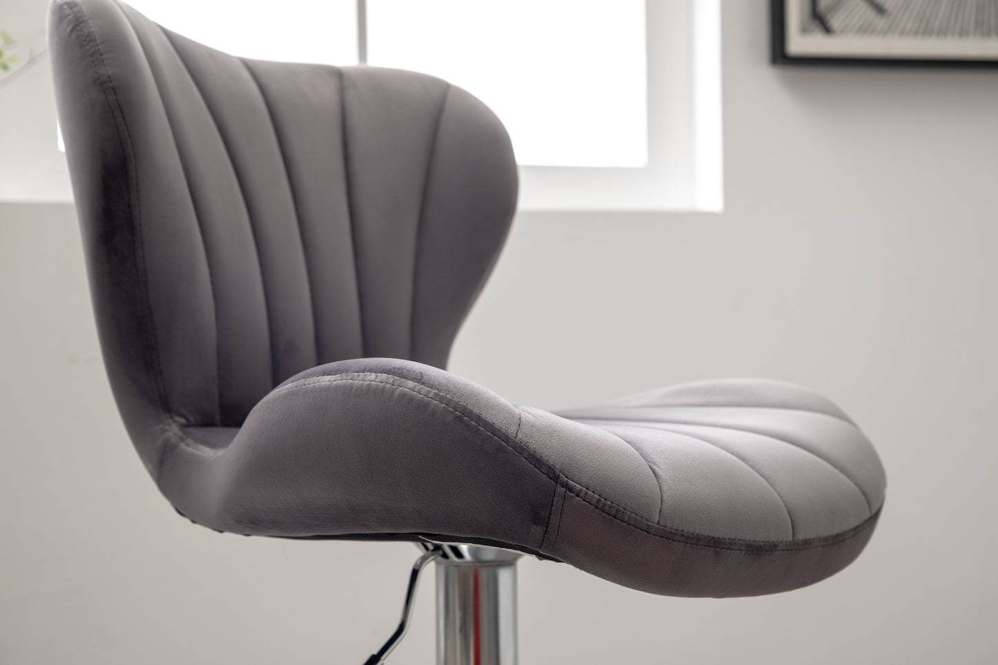Gray velvet swivel bar stool with channel tufting and chrome base