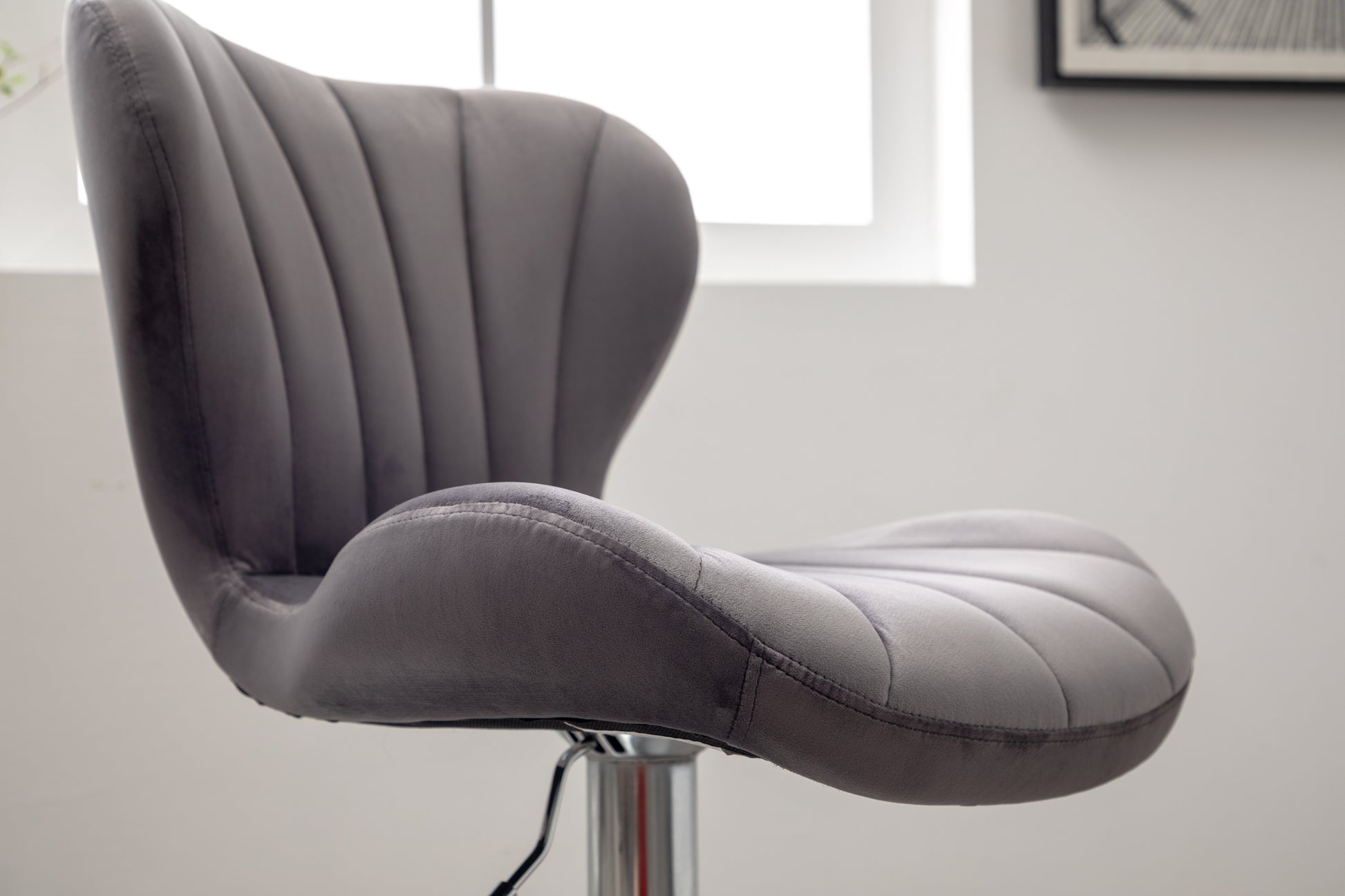Gray velvet swivel bar stool with channel tufting and chrome base