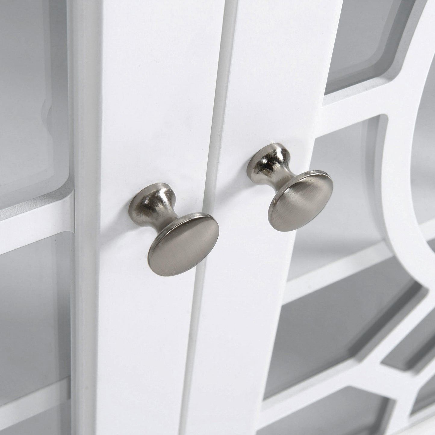 White cabinet with brushed nickel knobs and lattice detail