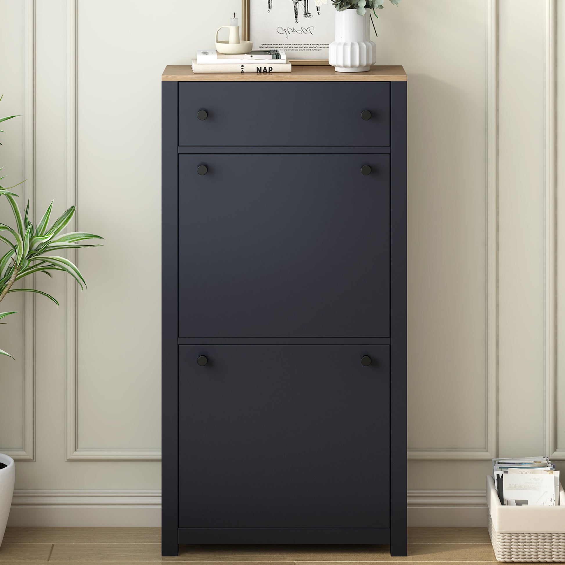Dark blue entryway shoe cabinet with three flipdown doors and wood top