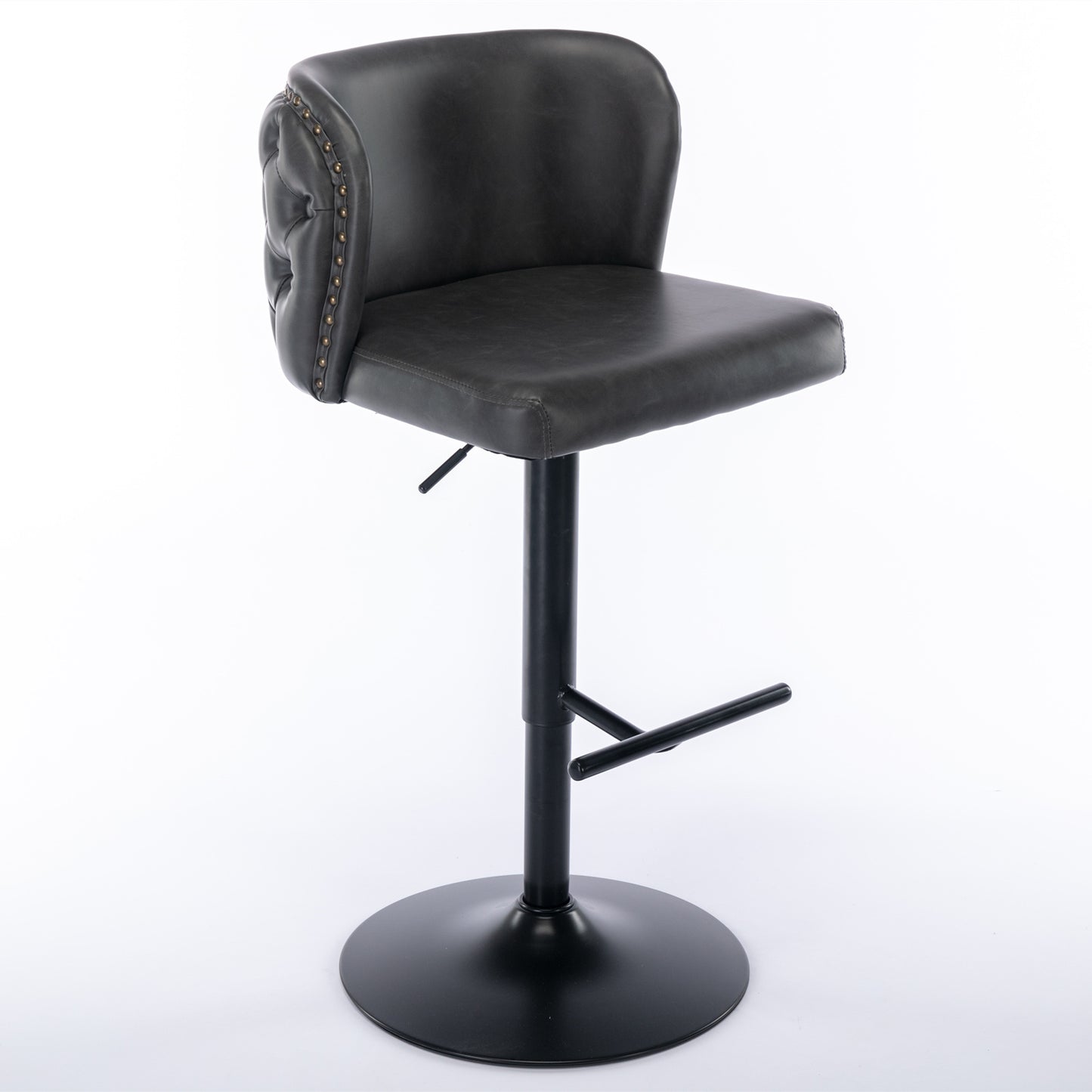 Dark grey faux leather bar stool with tufted back and brass nailhead trim