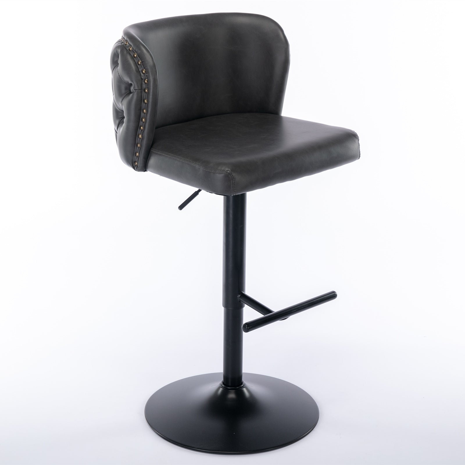 Dark grey faux leather bar stool with tufted back and brass nailhead trim