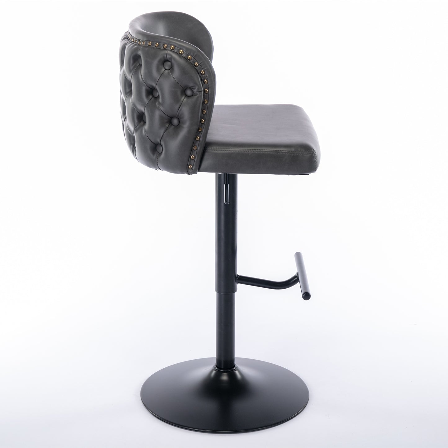 Gray tufted leather bar stool with brass nailhead trim and adjustable height