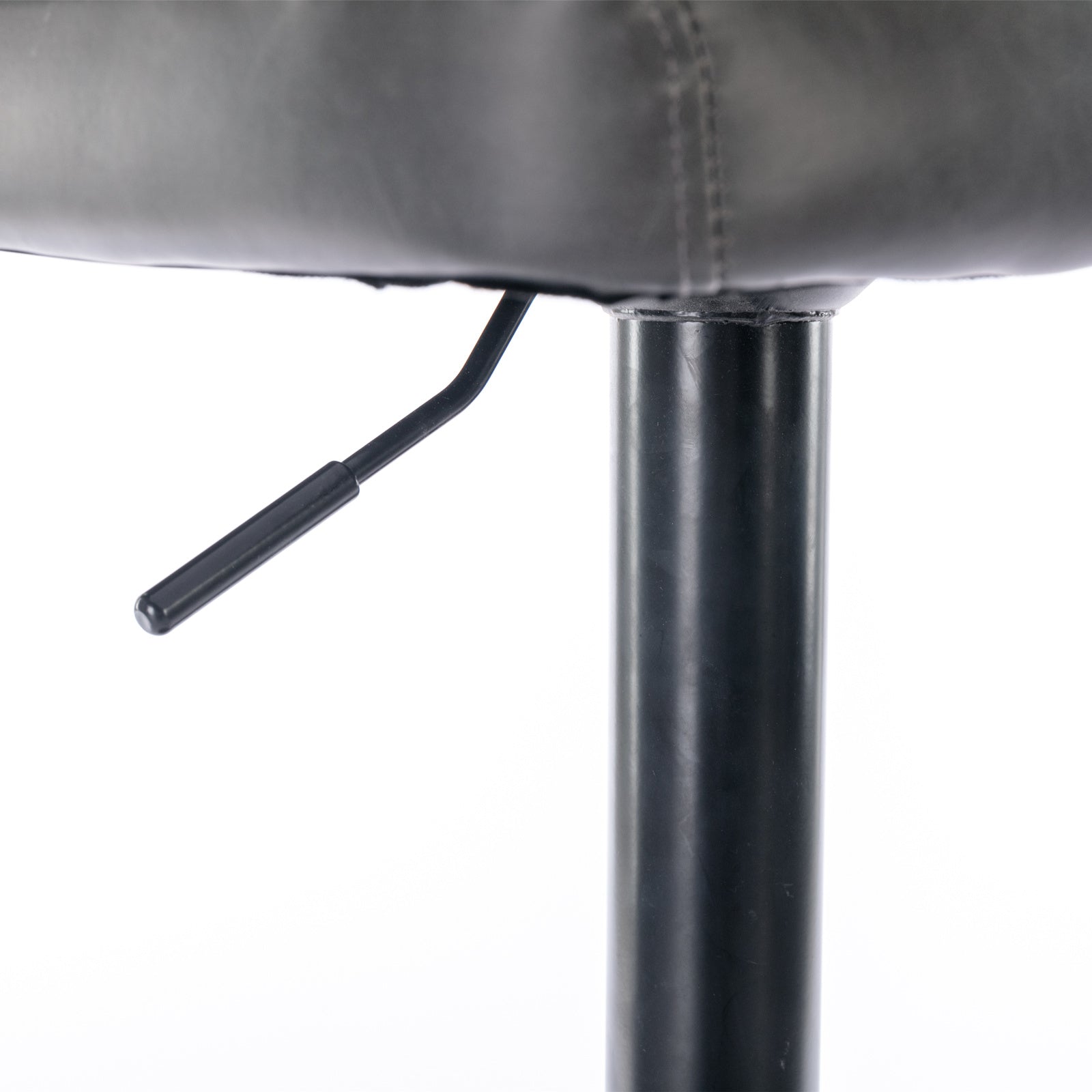 Closeup of a black leather bar stool seat with a silver height adjustment lever