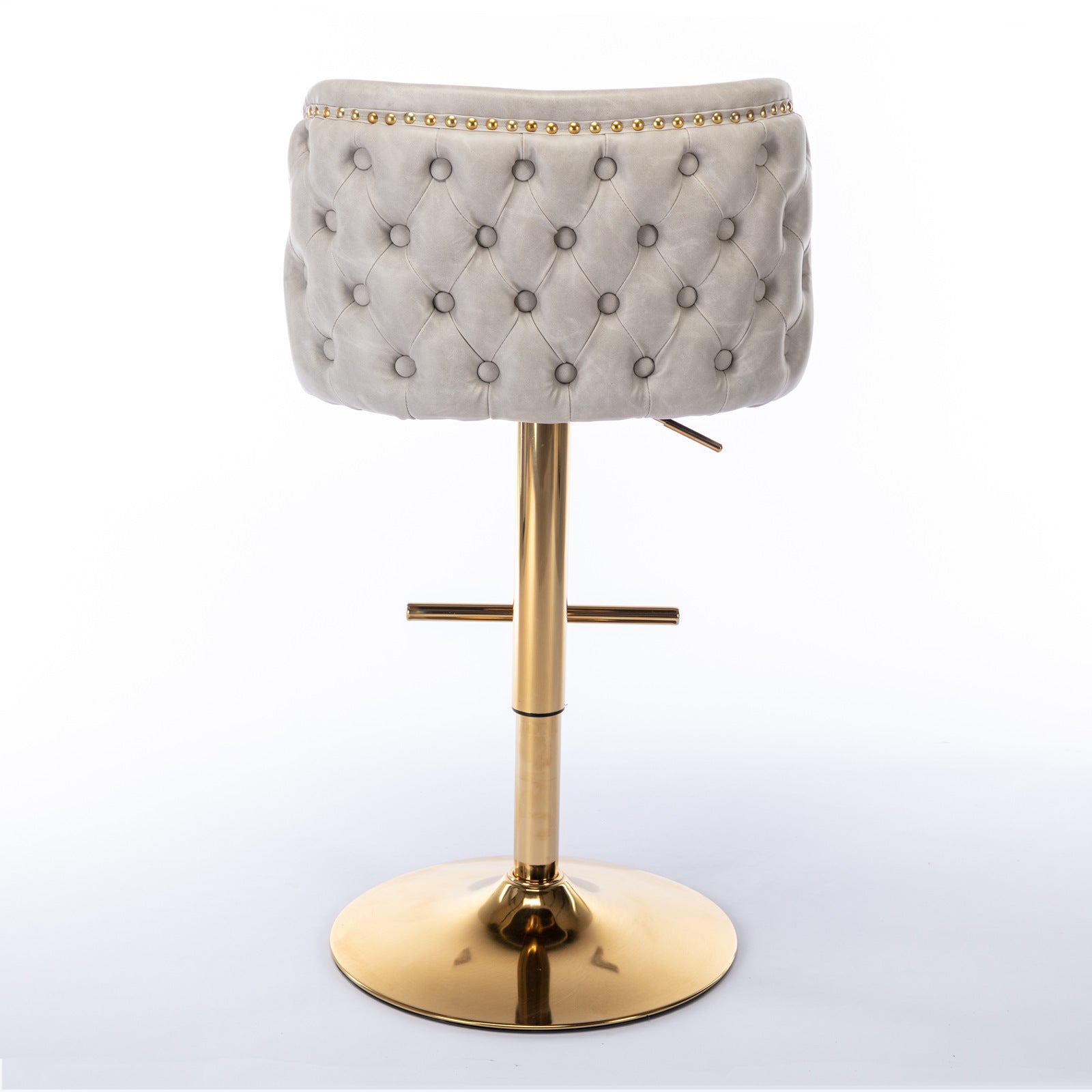 Tufted grey velvet bar stool with gold base and decorative nailhead trim