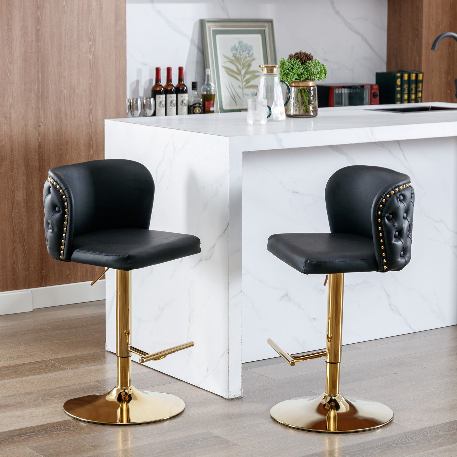 Black tufted leather bar stool with gold base and accents