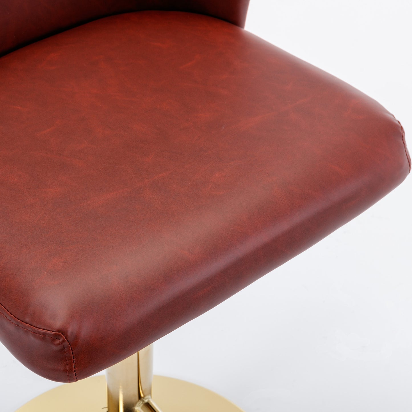 Brown faux leather bar stool seat with gold base