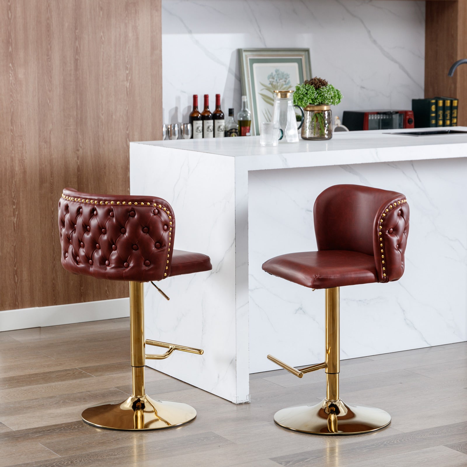 Maroon tufted bar stool with gold base and nailhead trim