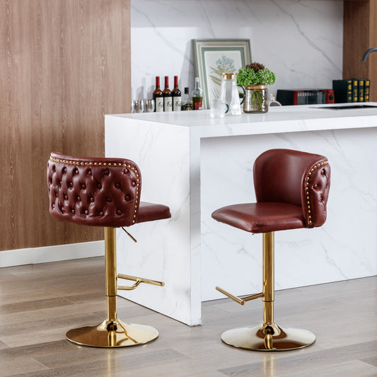 Maroon tufted bar stool with gold base and nailhead trim