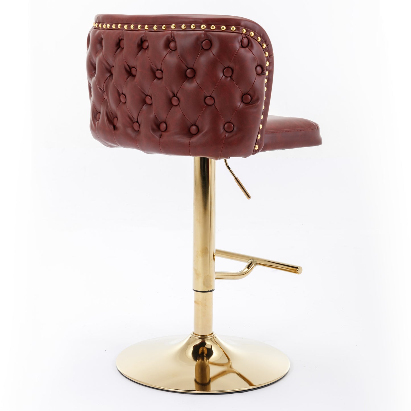 Red tufted faux leather bar stool with gold accents and a polished gold base