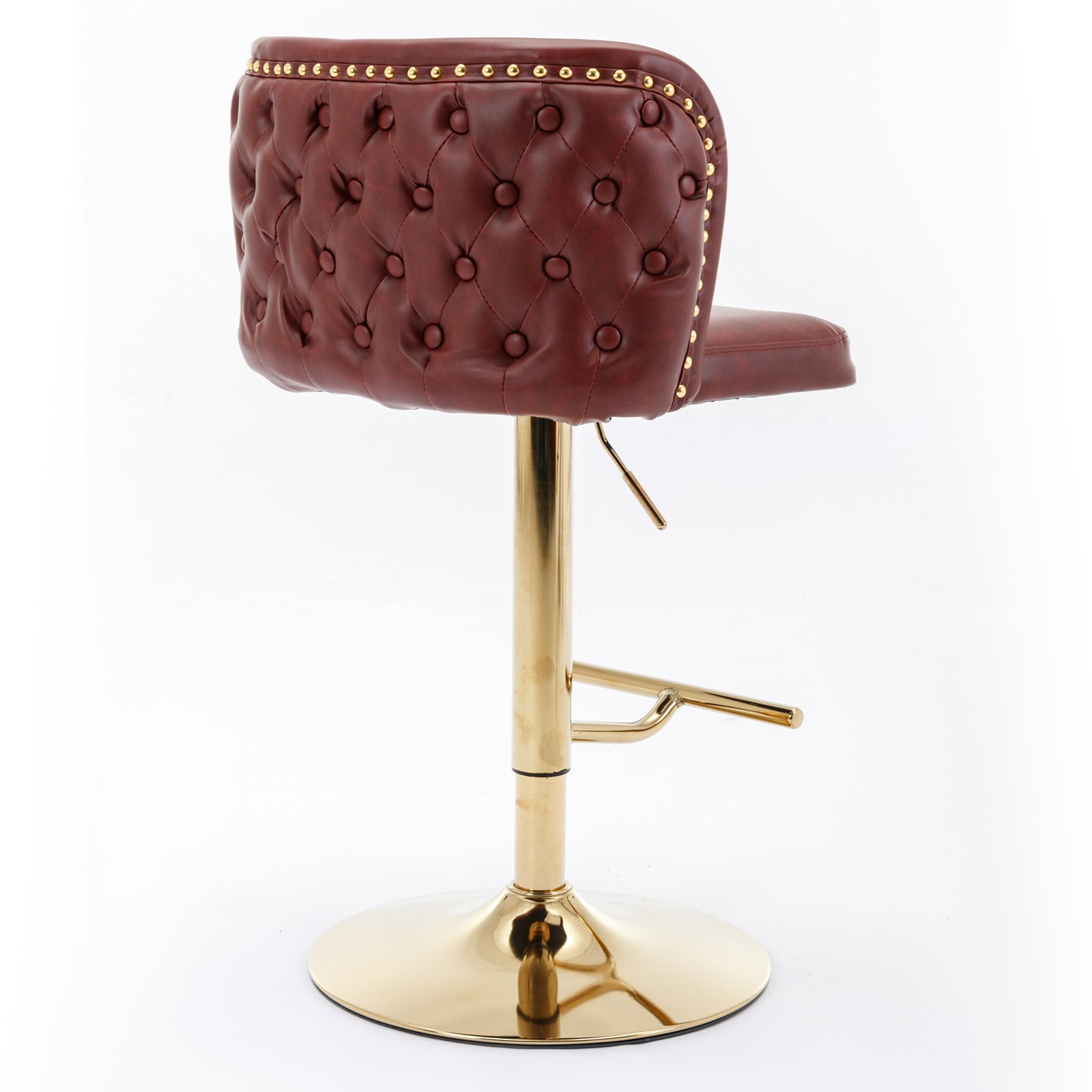 Red tufted faux leather bar stool with gold accents and a polished gold base