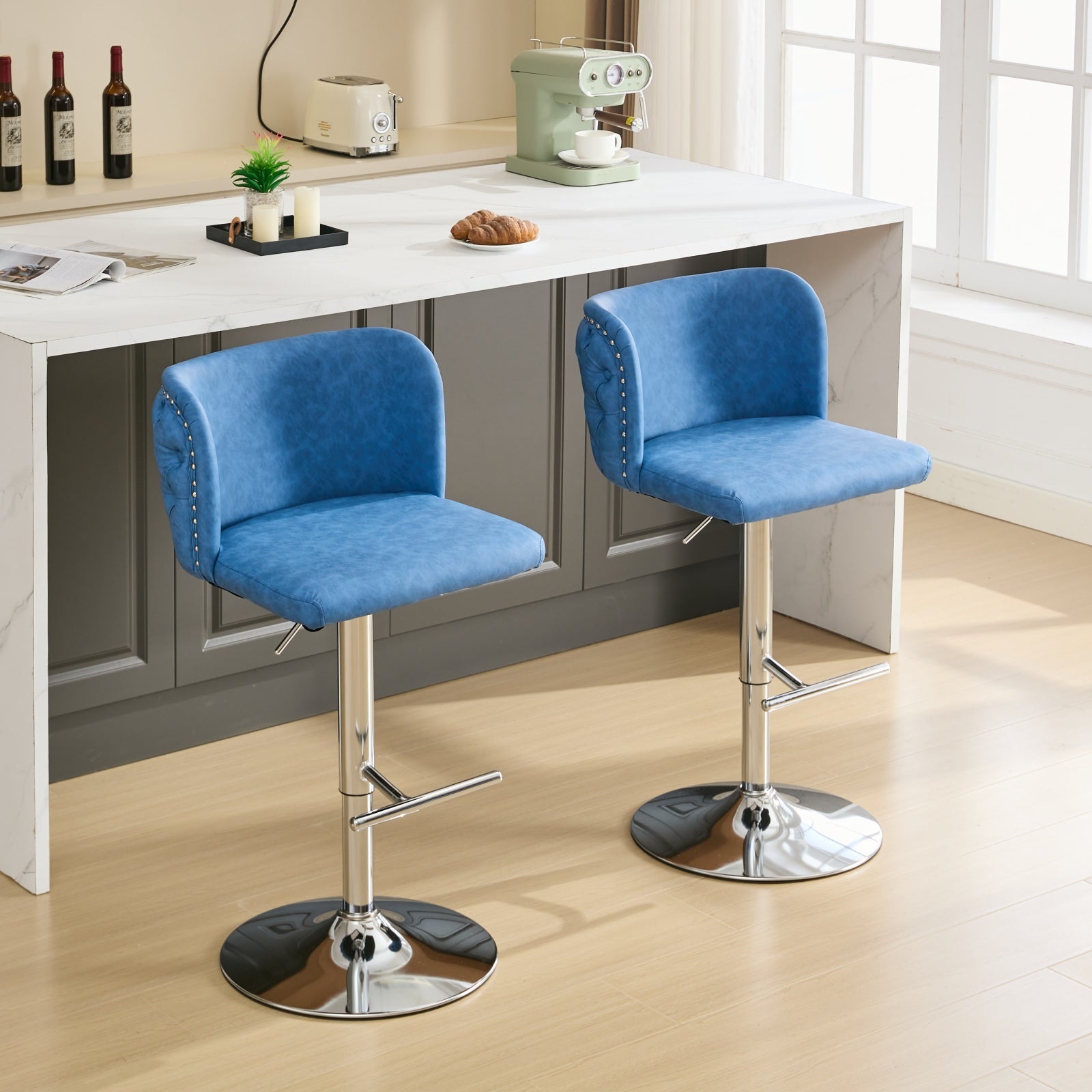 Blue velvet bar stool with silver nailhead trim and adjustable chrome base