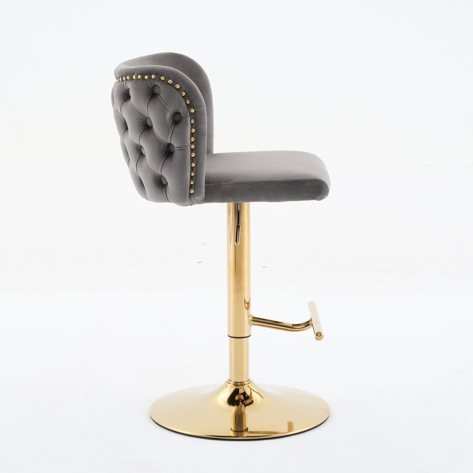 Tufted grey velvet bar stool with gold legs and accents