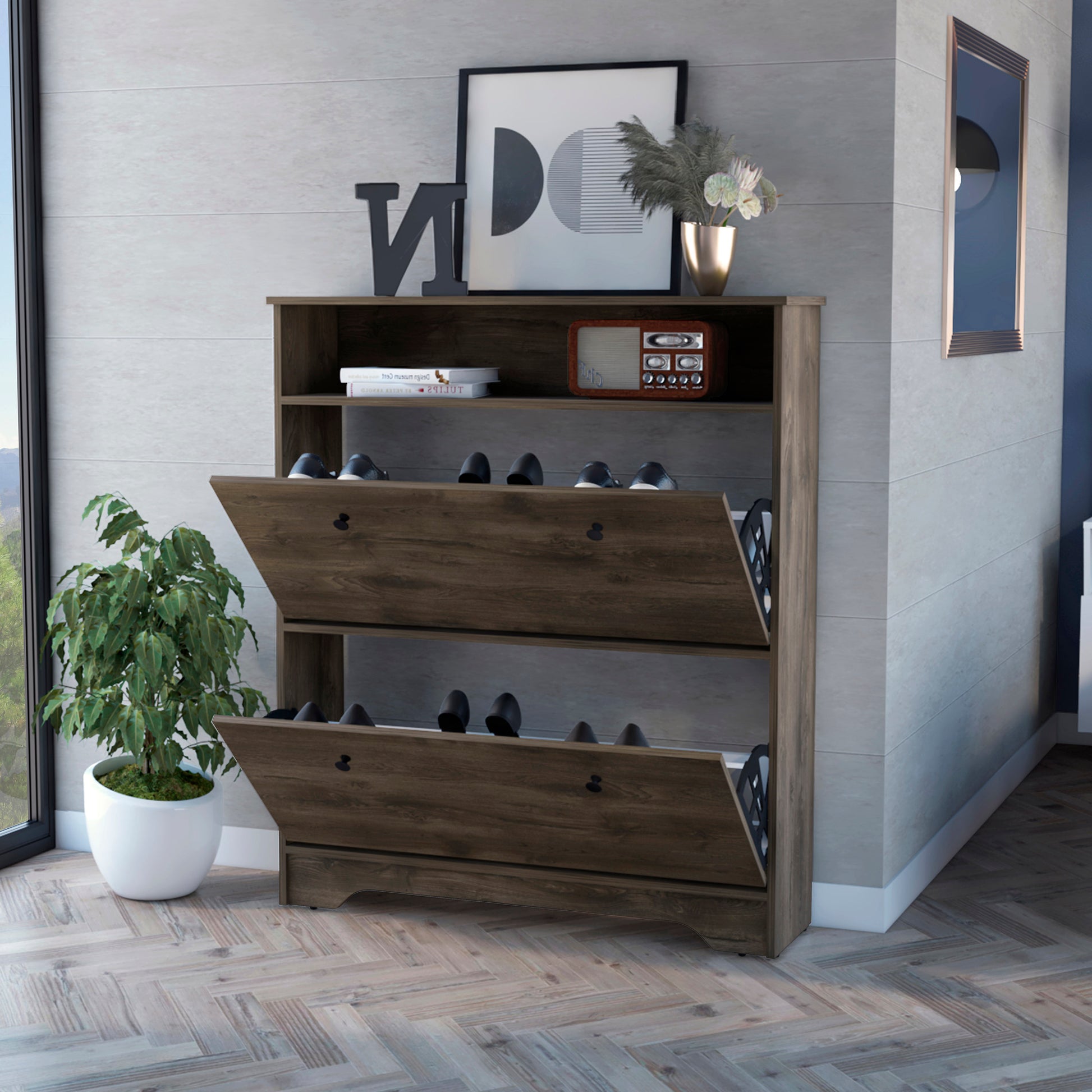 Rustic dark wood shoe cabinet with two flipdown drawers holding black shoes