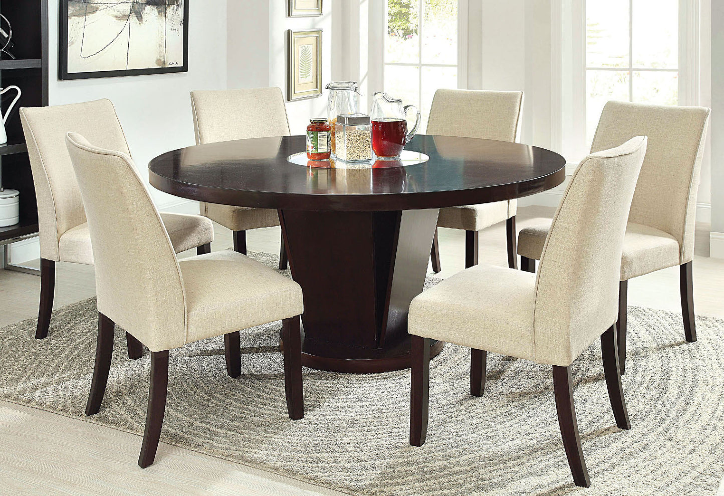 Dark wood round dining table with six beige upholstered chairs