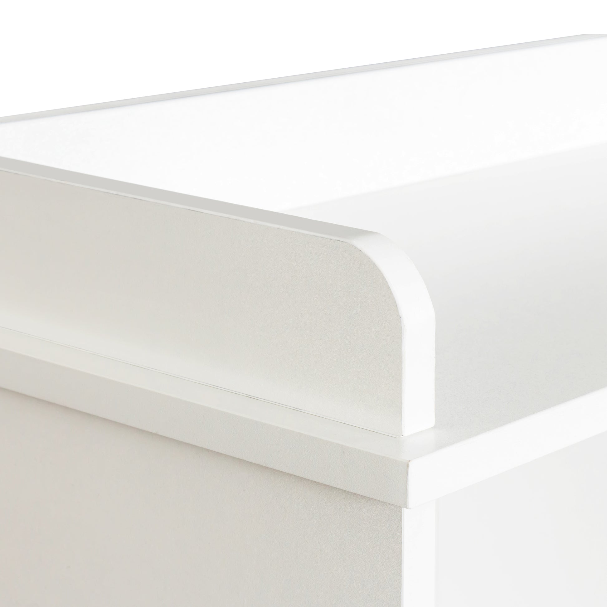 Closeup of white baby changing table edge detail
