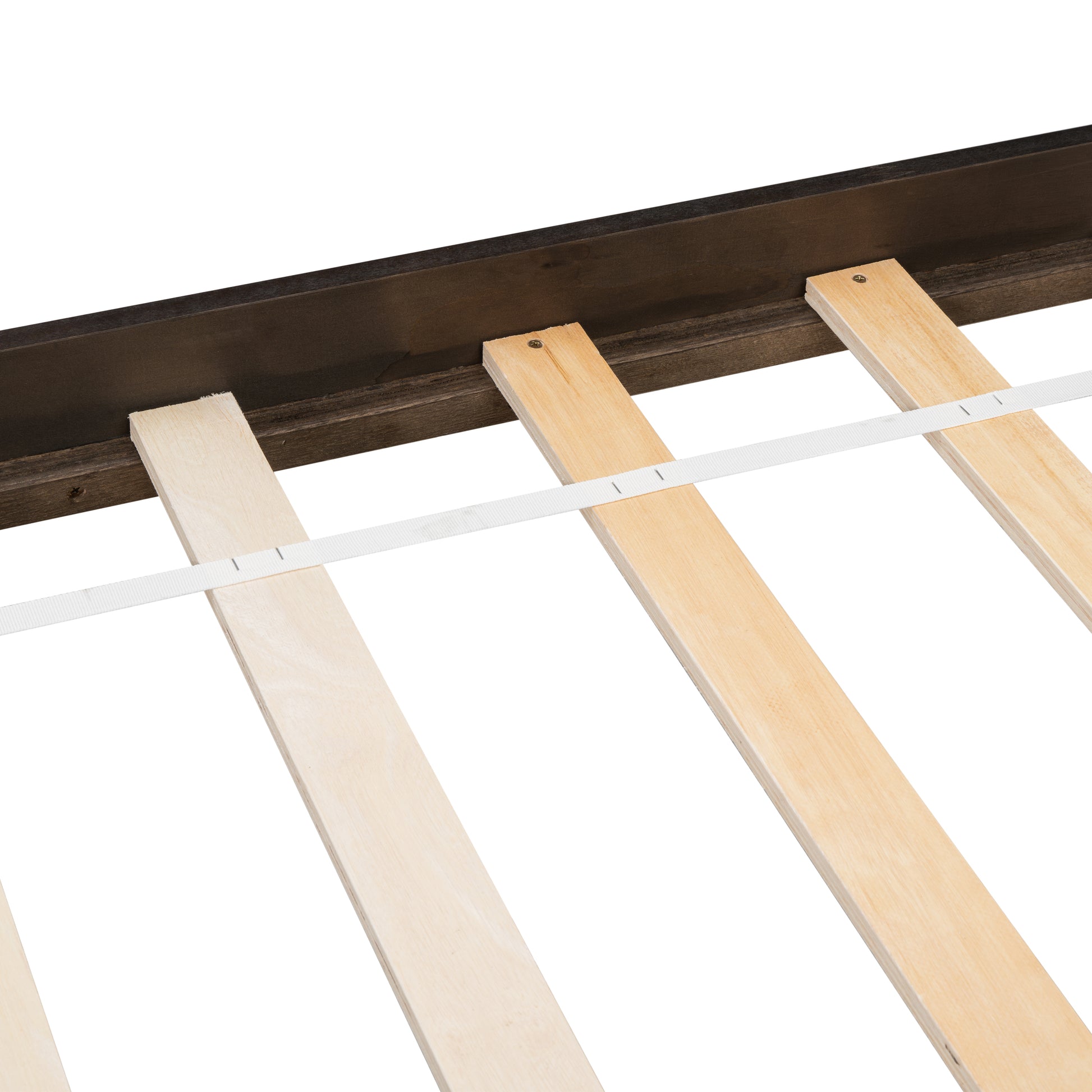 Closeup of a dark wood bed frame with natural pine wood slats