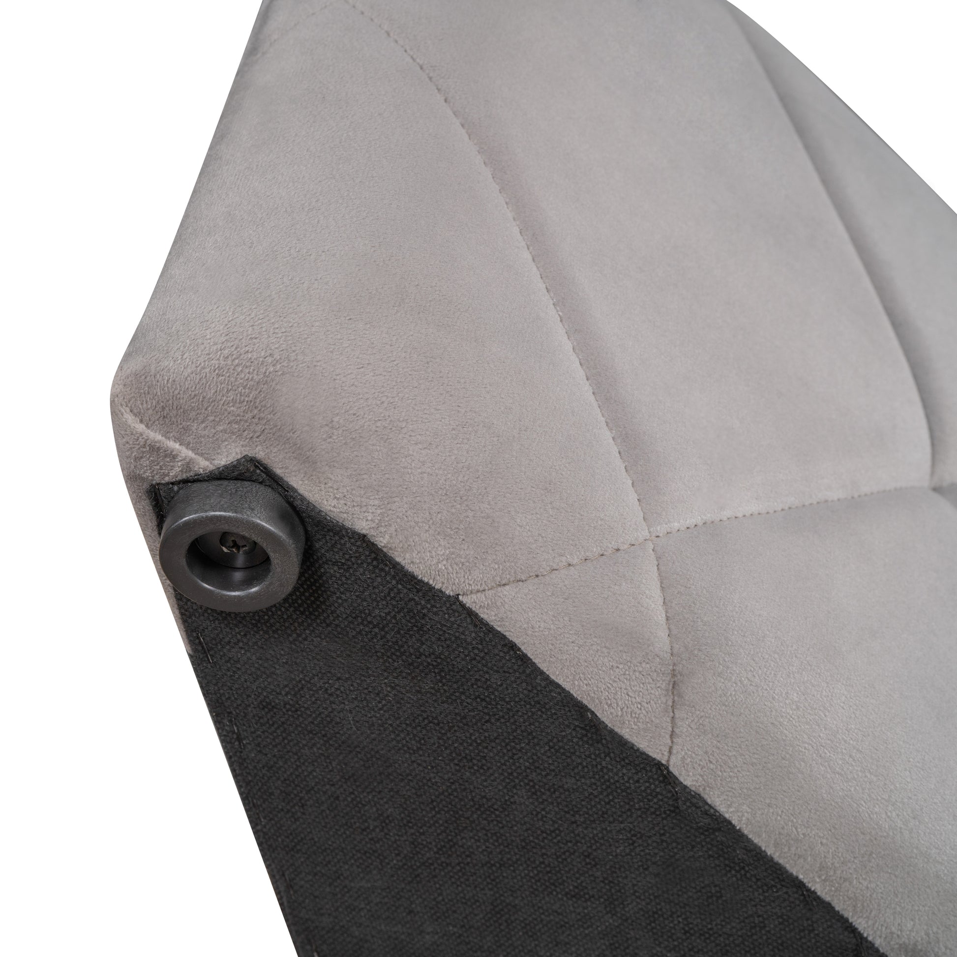 Closeup of gray suede upholstery on a chair with a black plastic foot