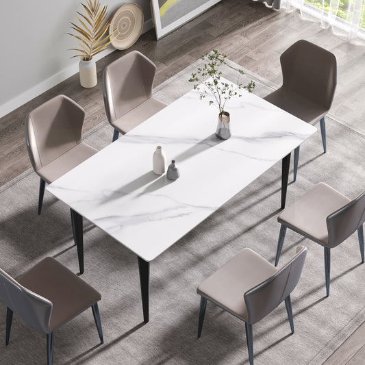 Modern dining chairs around a marbletop dining table
